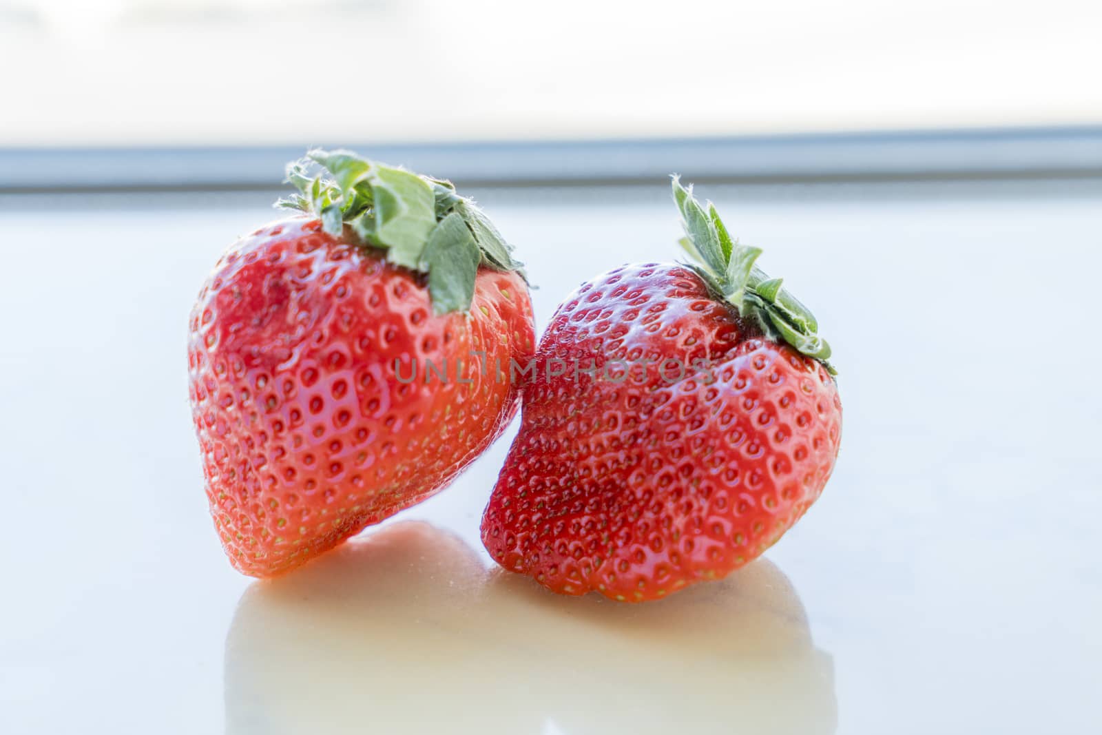 Close up of fresh strawberries on white background