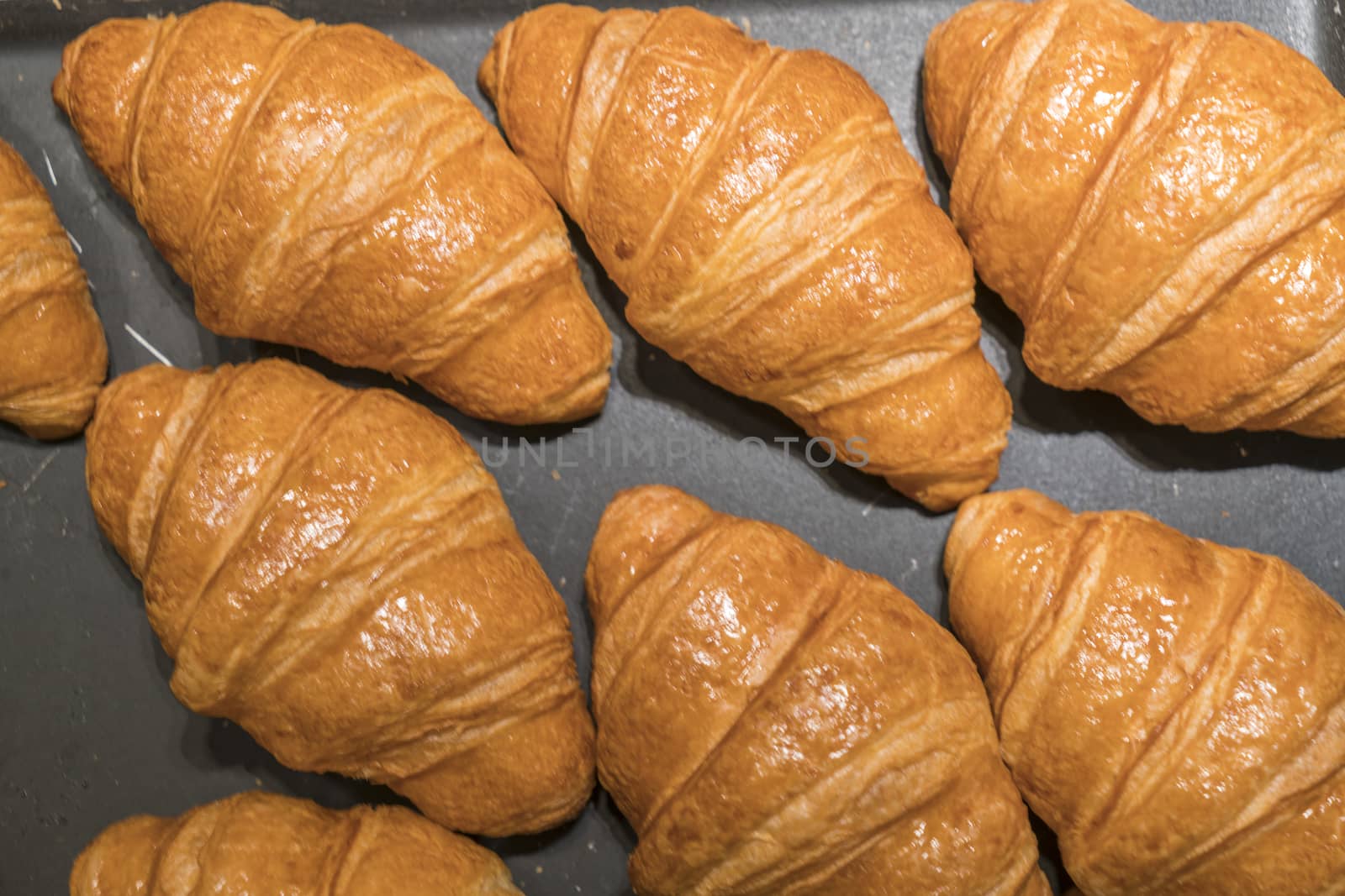 Croissants on a black background from above