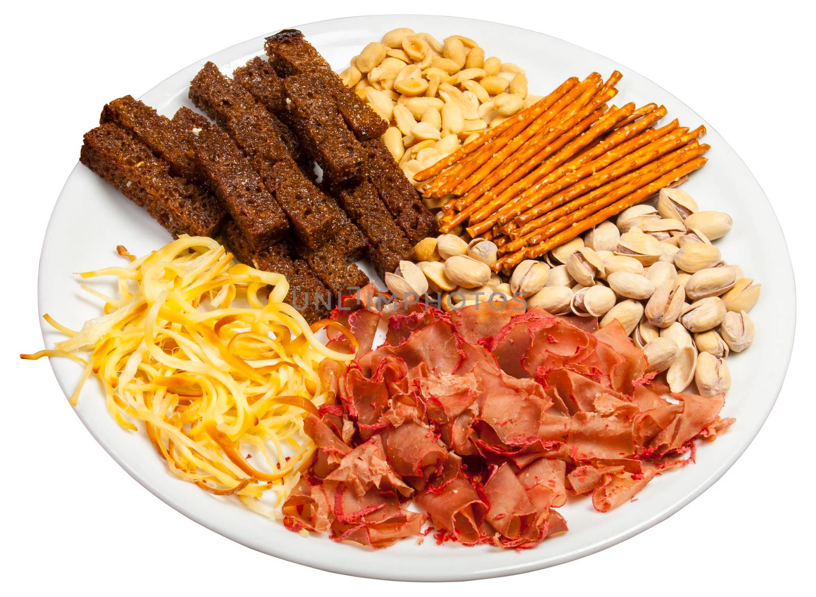 Plate full of crunchy, salty snacks, peanuts, pistachio nut cheese and meat