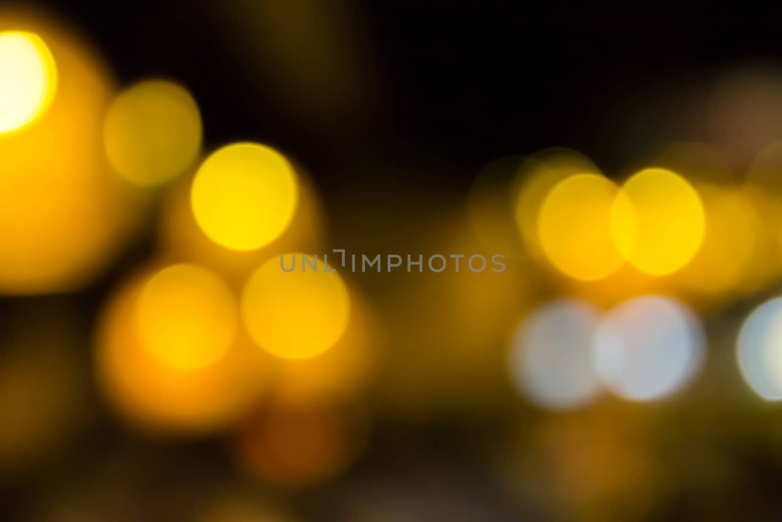 abstract background of blurred warm 
lights with cool blue spots with bokeh effect