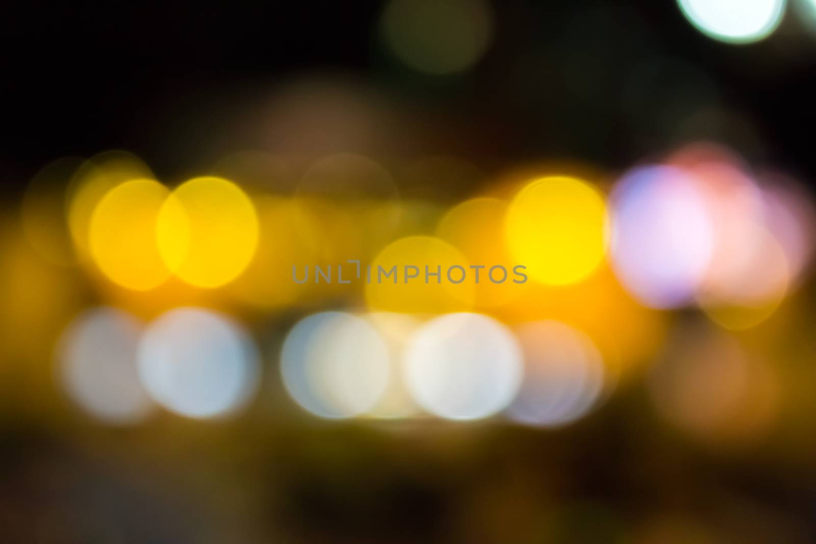 abstract background of blurred warm 
lights with cool blue spots with bokeh effect