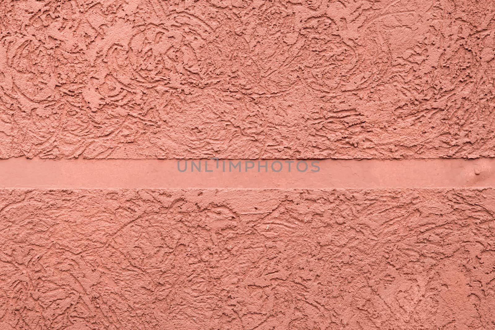 pink textured plaster with a smooth strip in the middle