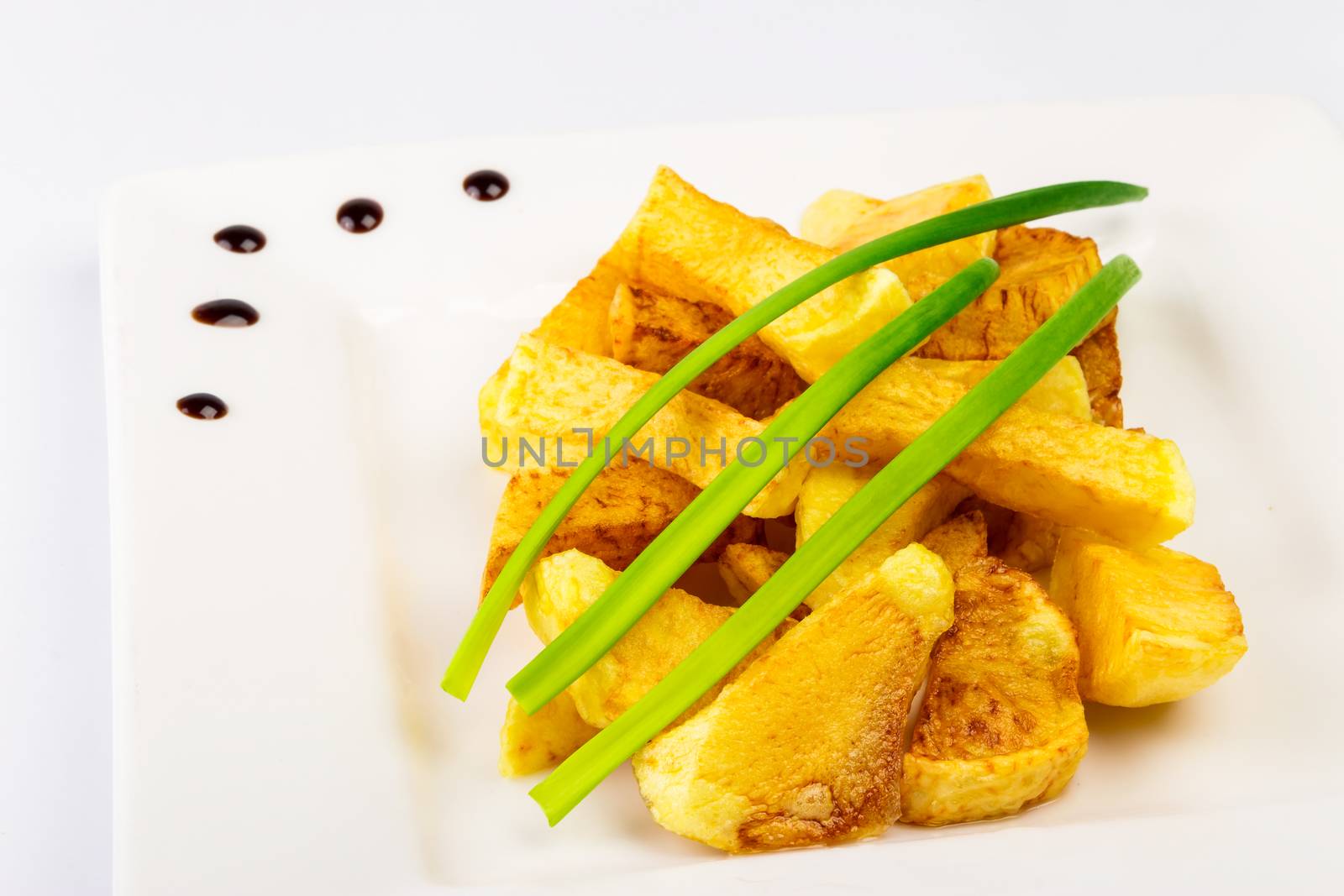 slide fried potatoes with shoots of green onions