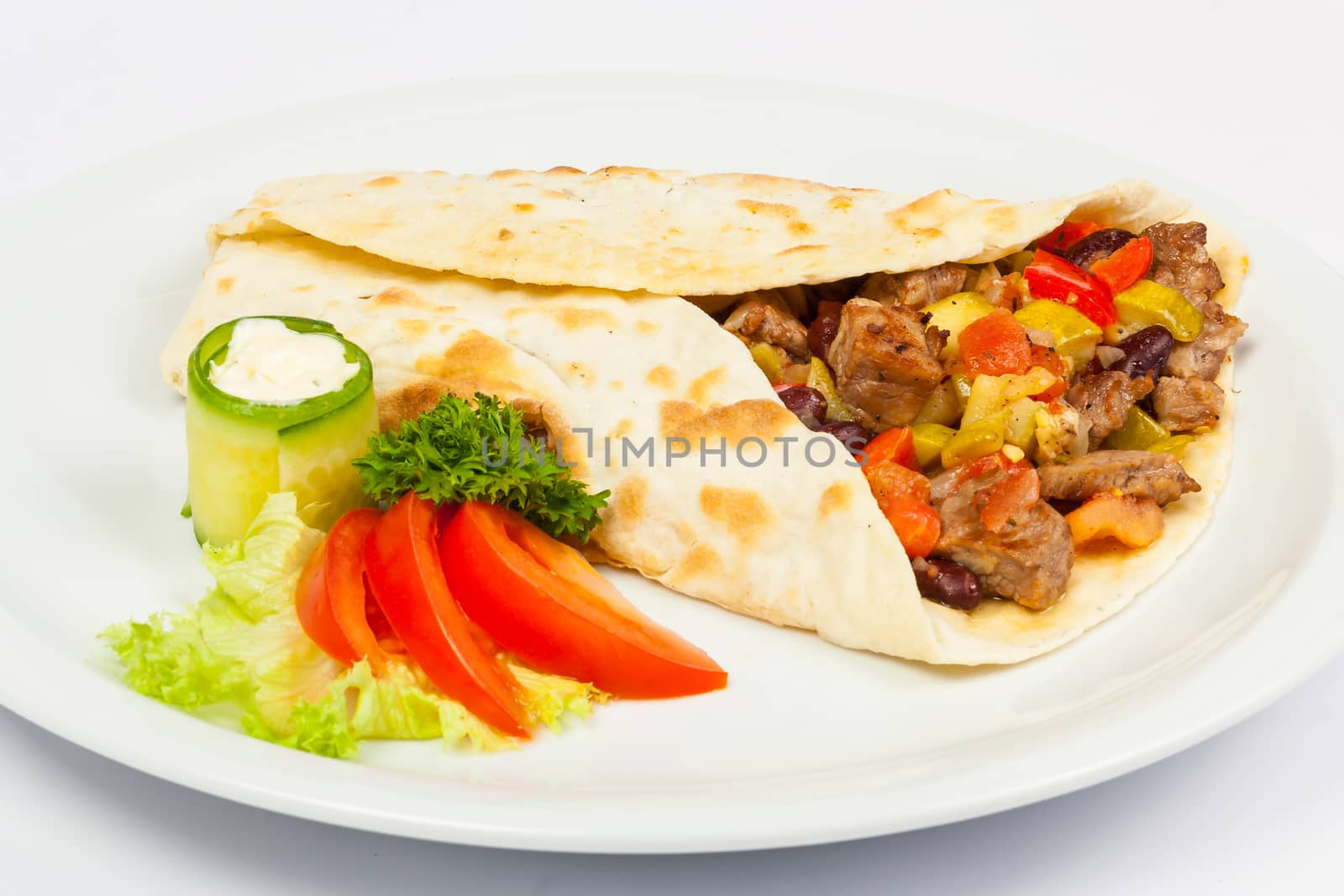 eastern spicy burrito with meat and vegetables