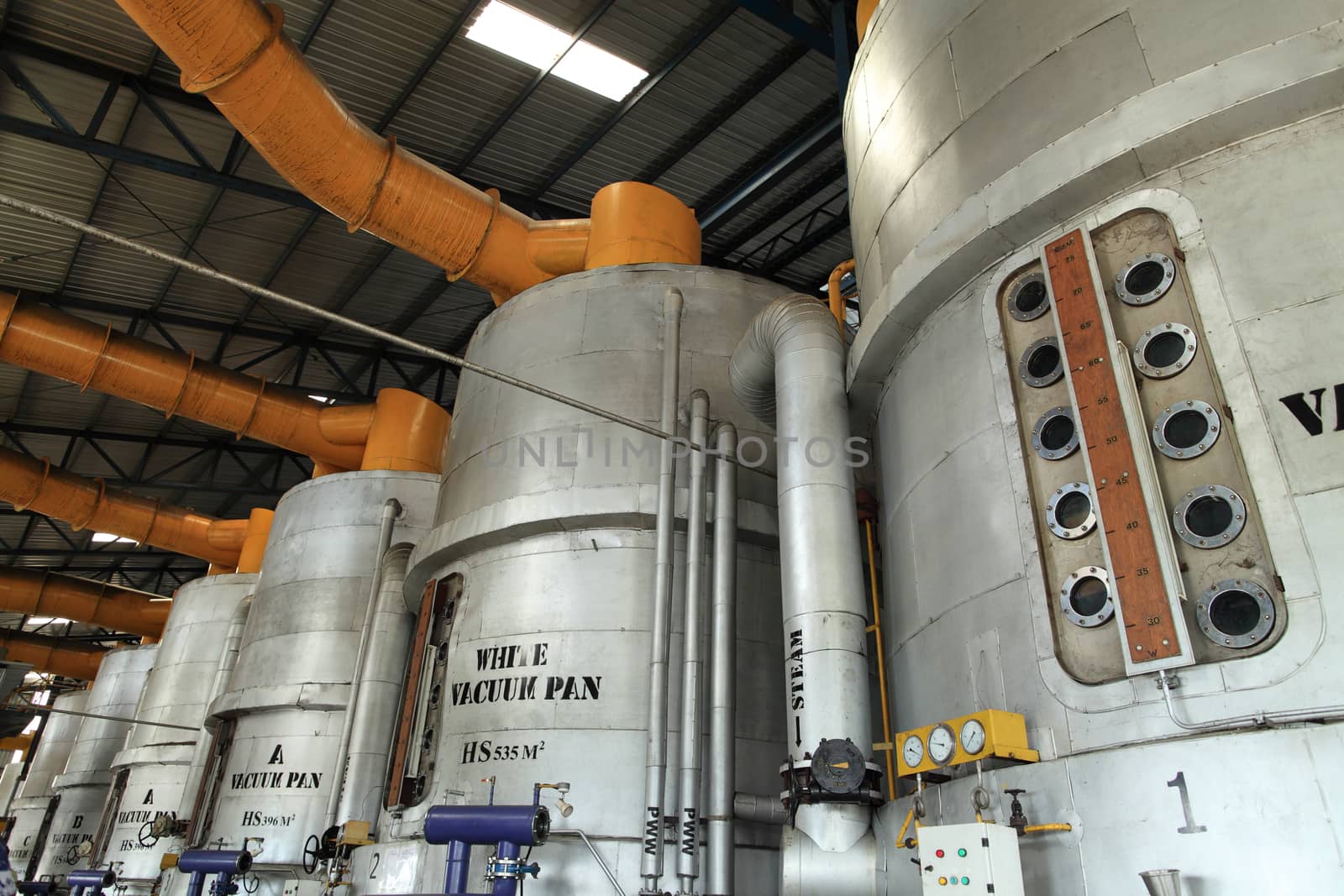 vacuum pan processing equipment in a modern sugar mill factory