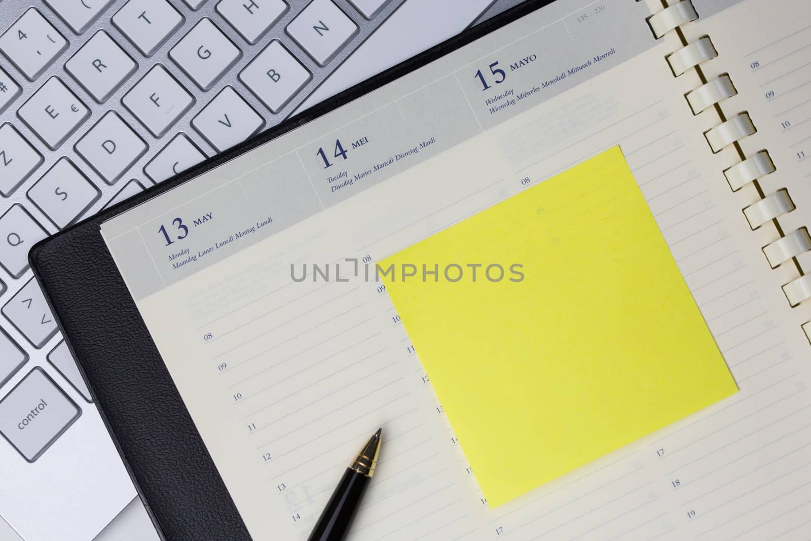 Paper note with blank area in business desk by pixinoo