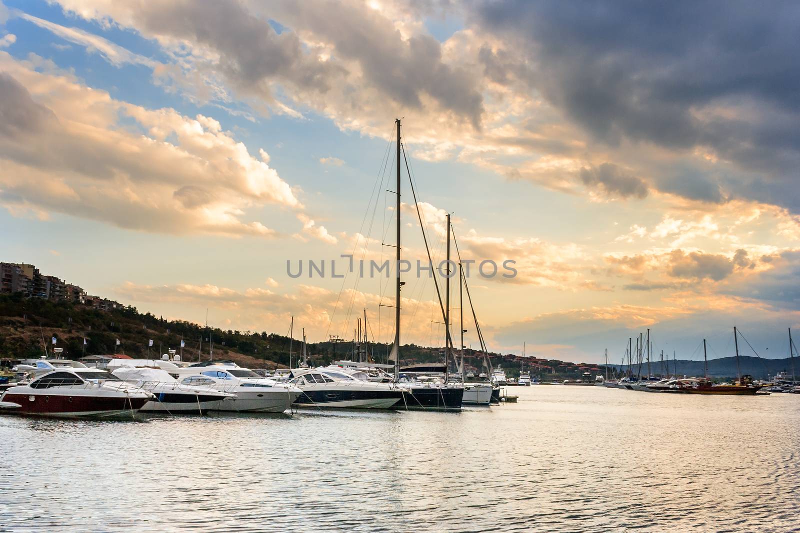 yacht at the pier of the old city in anticipation of an evening storm