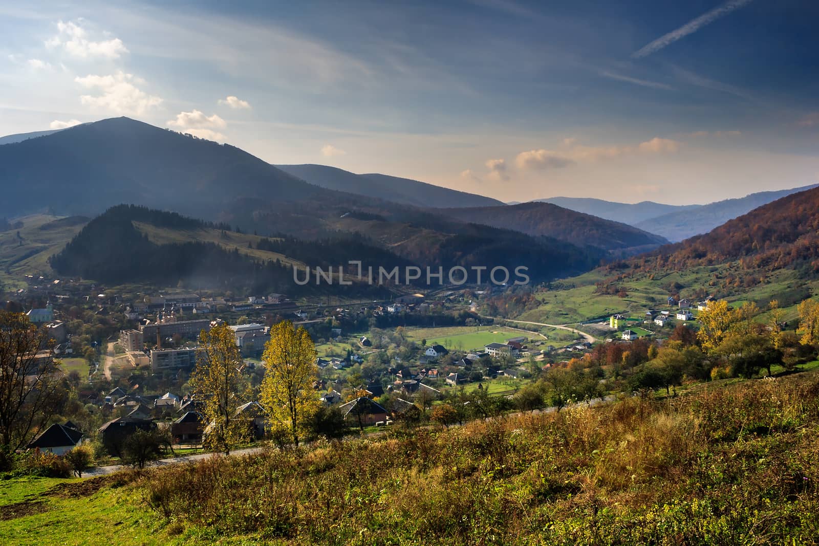 autumn landscape. view from the hill over the city in a mountain valley