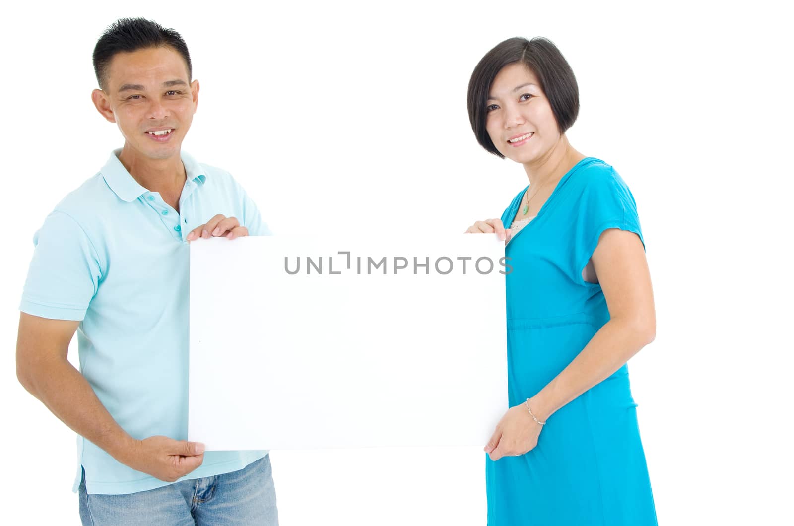 Middle Couple Holding a Blank Sign