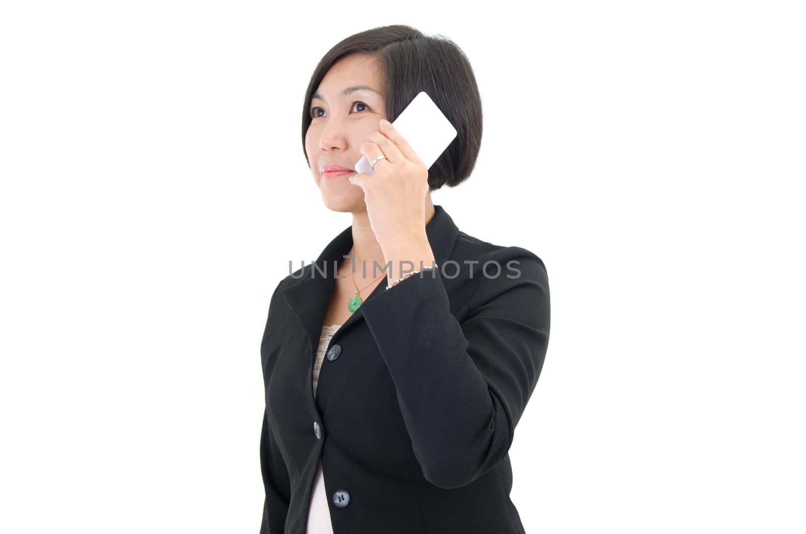 On the phone. Asian business woman on the phone, looking at side.