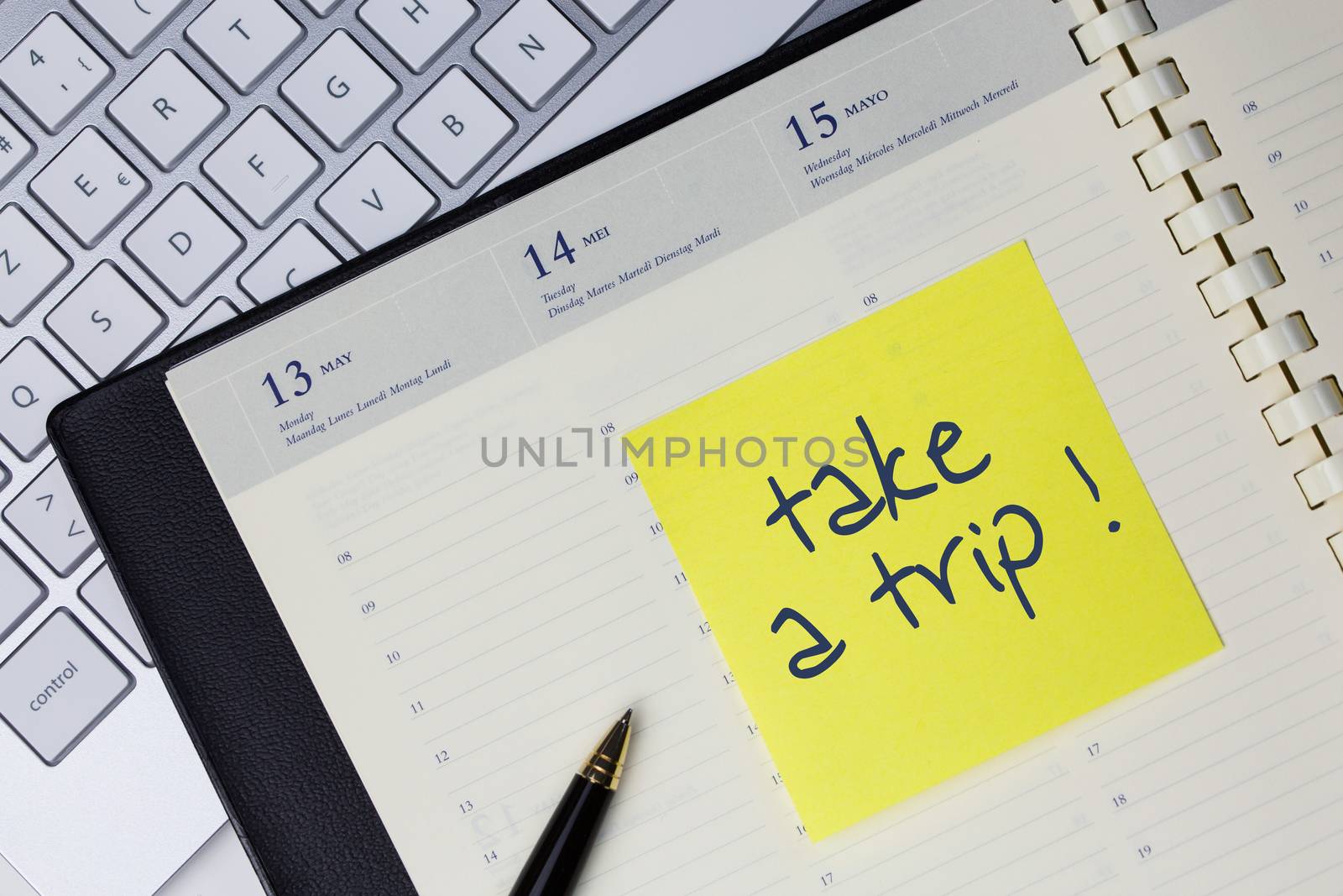 Paper note with the words - take a trip- in business desk. How to get better concept