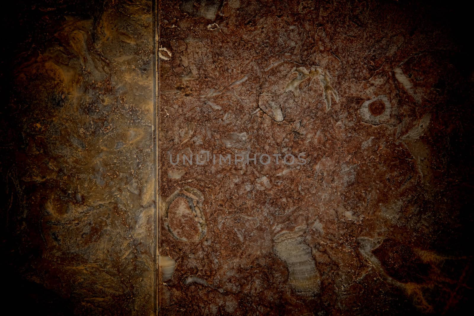 Vignetted stone wall background with lots of texture