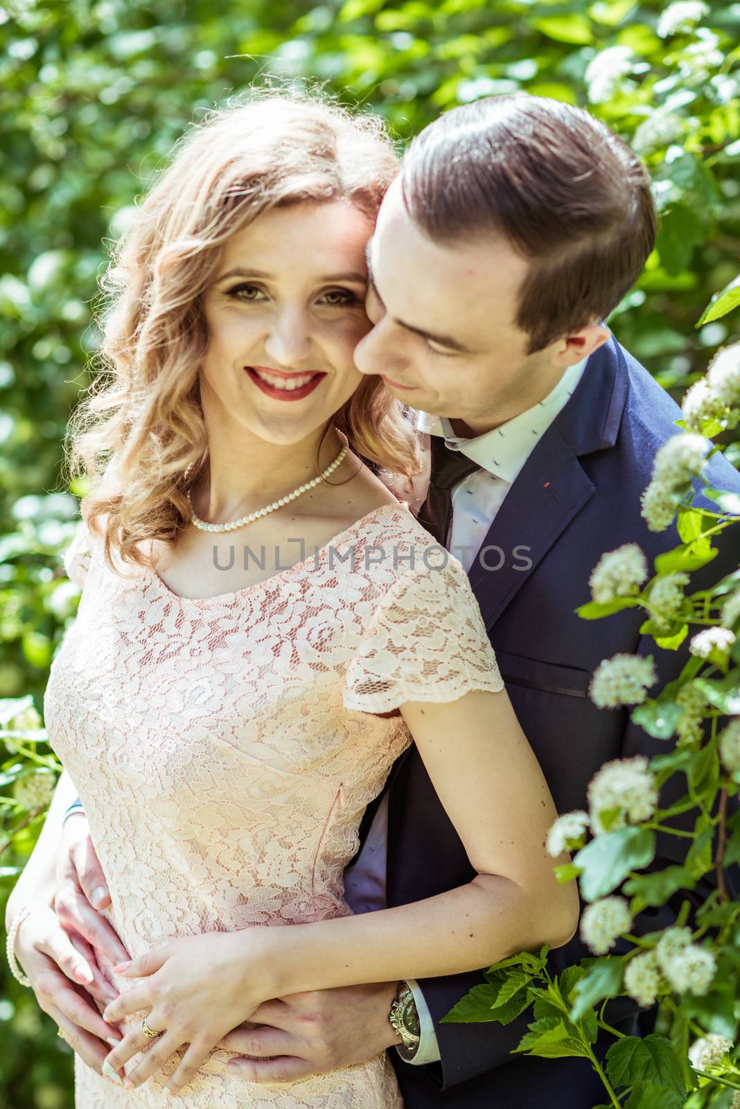 Cheerful couple in the meadow by okskukuruza