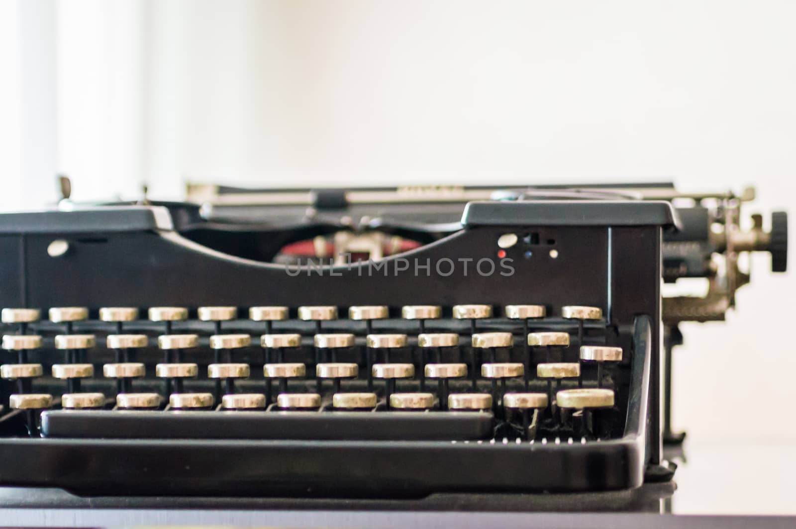 Close up french old typewriter on a white background