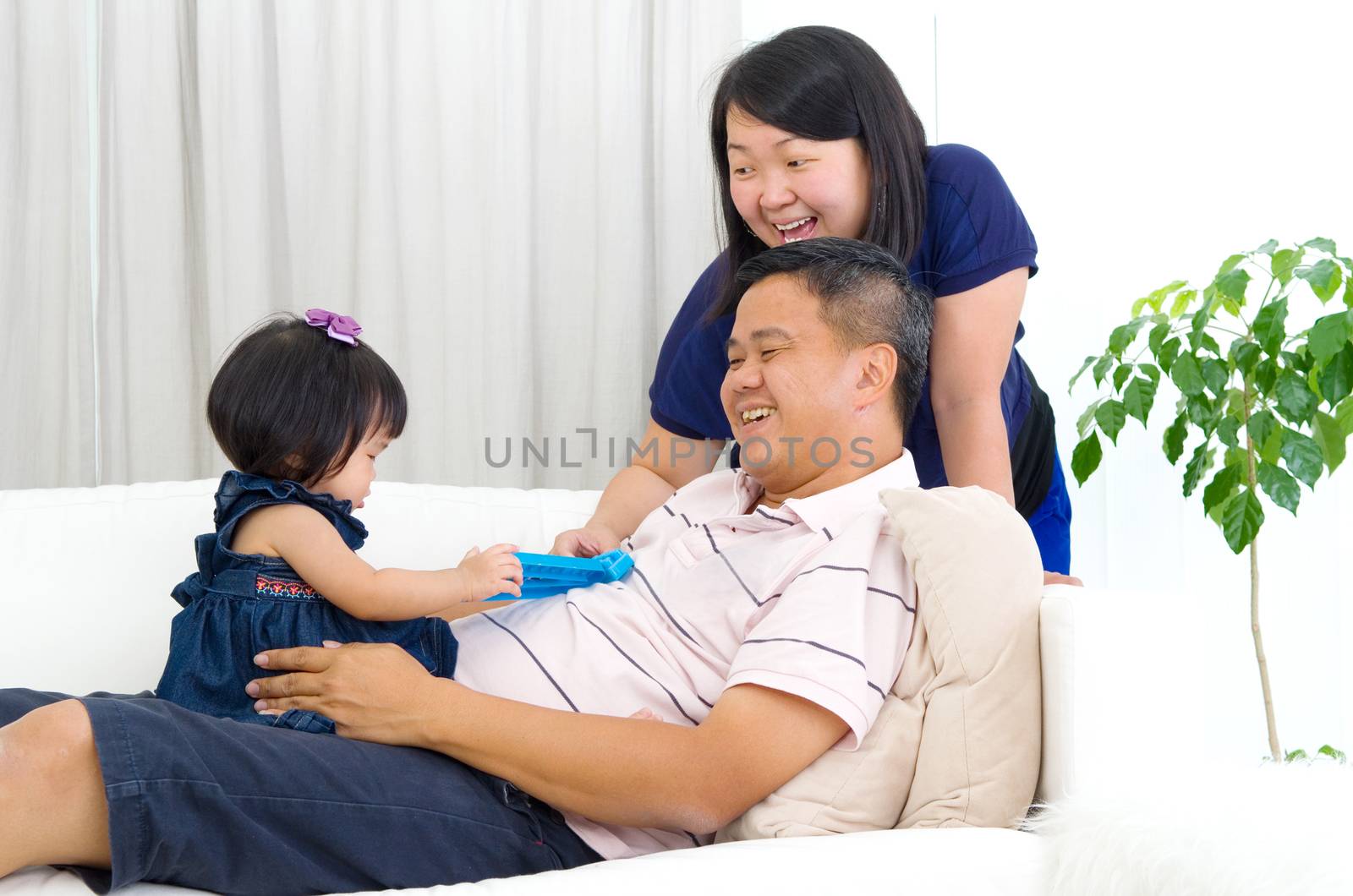 Asian family having fun at home