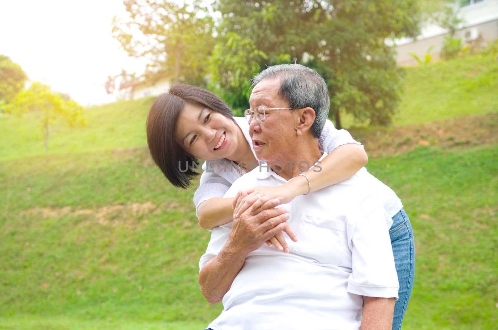 Senior man and daughter. Happy father talking with her daughter.