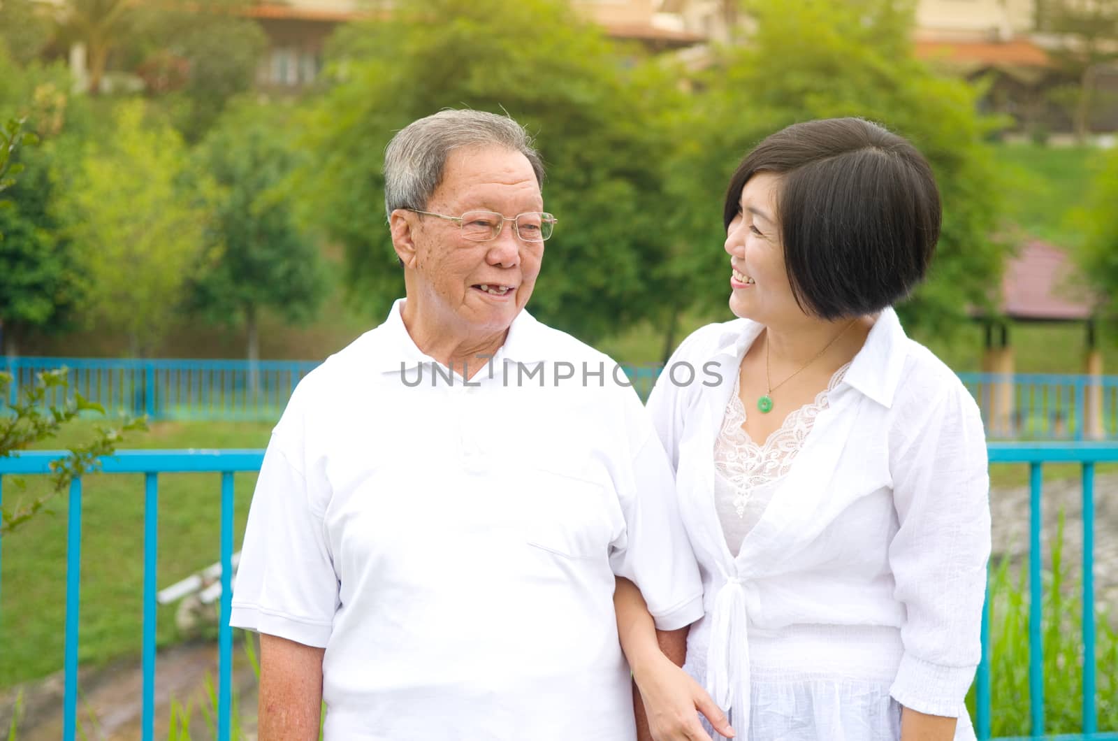 Senior man and daughter. Happy father talking with her daughter.