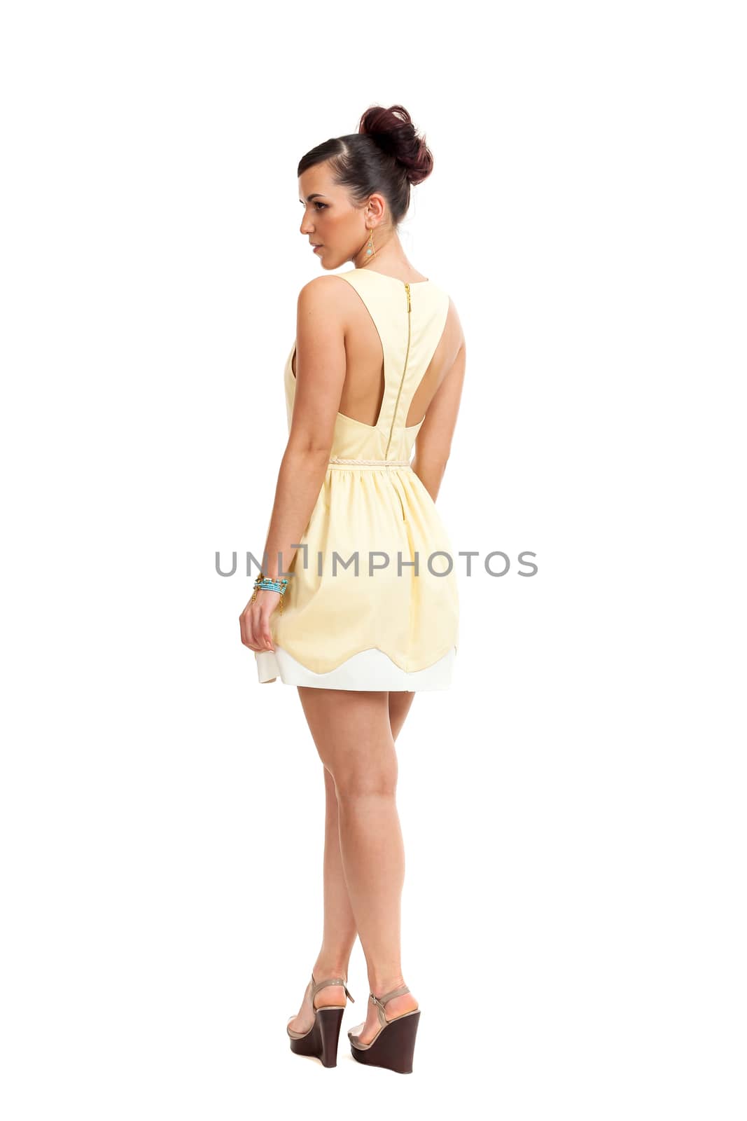 the young woman in a light dress on a white background
