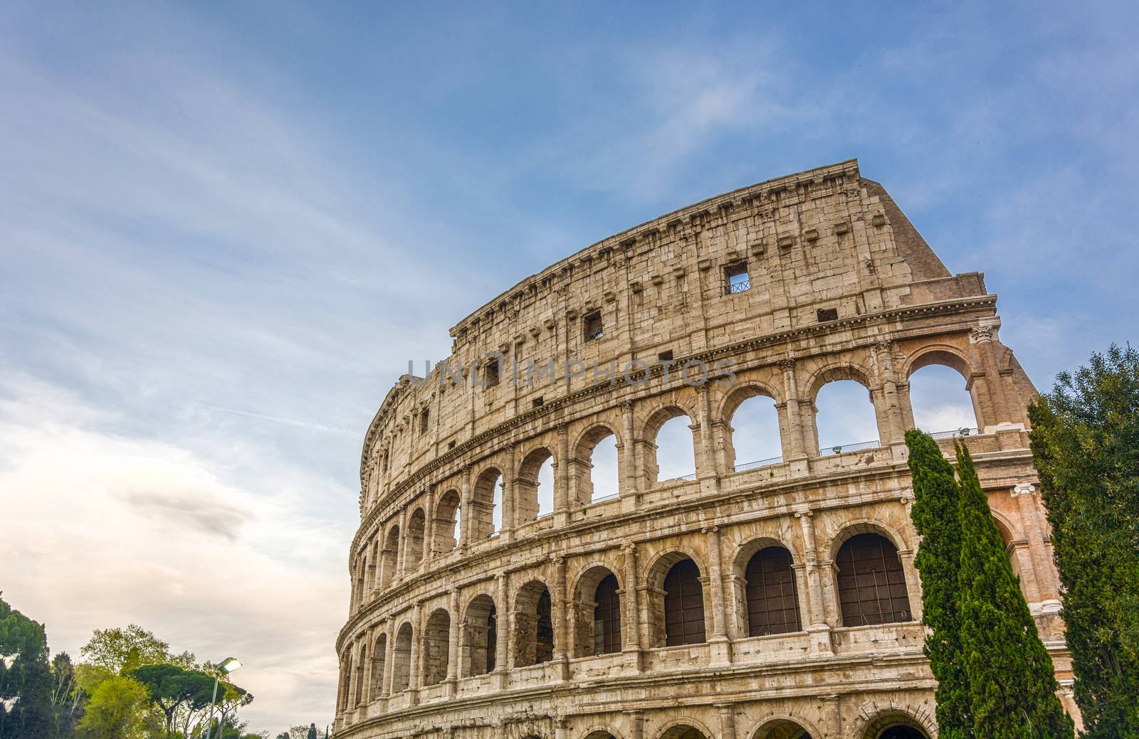 view on the Great Roman Colosseum Coliseum, Colosseo ,also known as the Flavian Amphitheatre. Famous world landmark. Scenic urban landscape. Rome. Italy. Europe