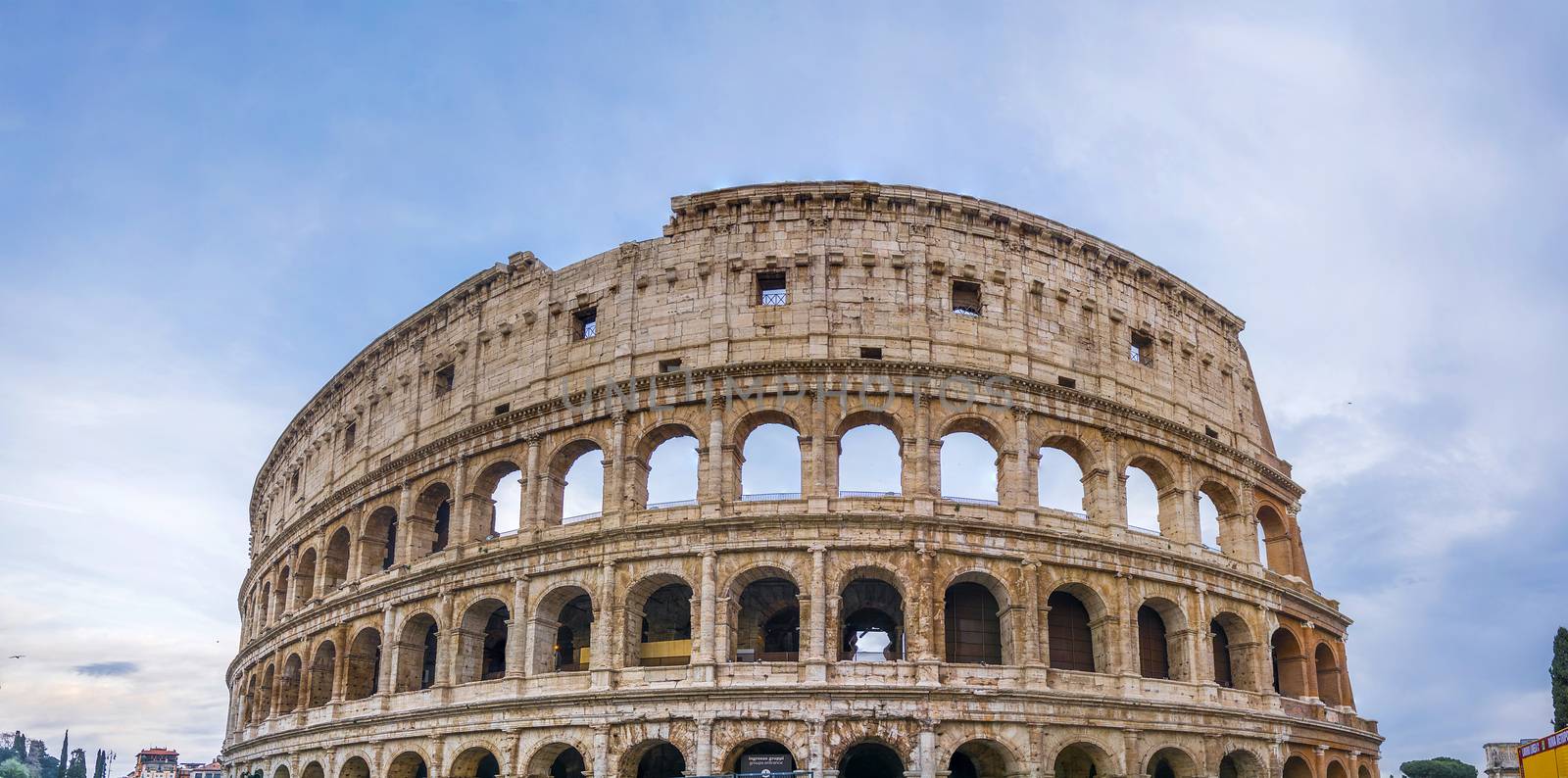 view on the Great Roman Colosseum Coliseum, Colosseo ,also known as the Flavian Amphitheatre. Famous world landmark. Scenic urban landscape. Rome. Italy. Europe