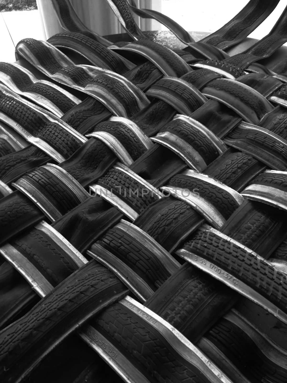 Photo first floor Creating mat with tyres used by bicycle ,modern art object , Black and White