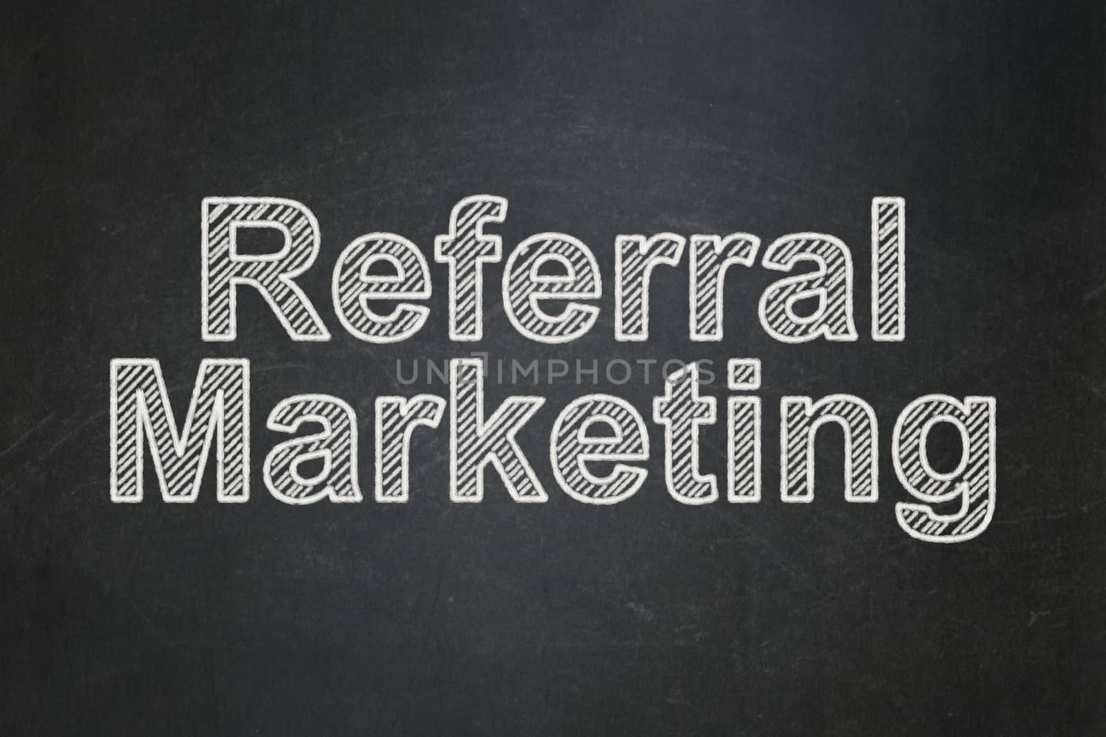 Advertising concept: text Referral Marketing on Black chalkboard background