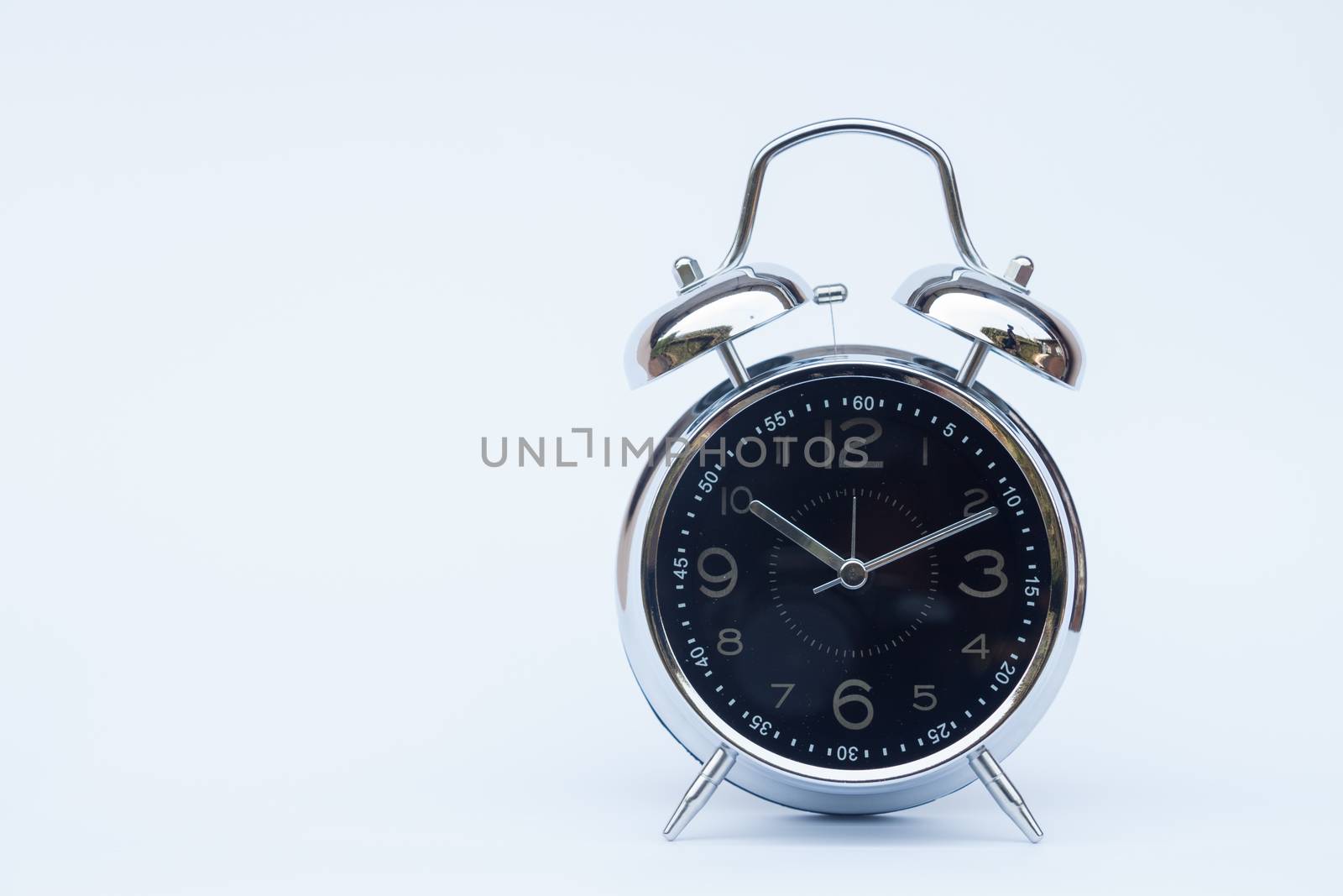 Alarm clock isolated on white background, stock photo