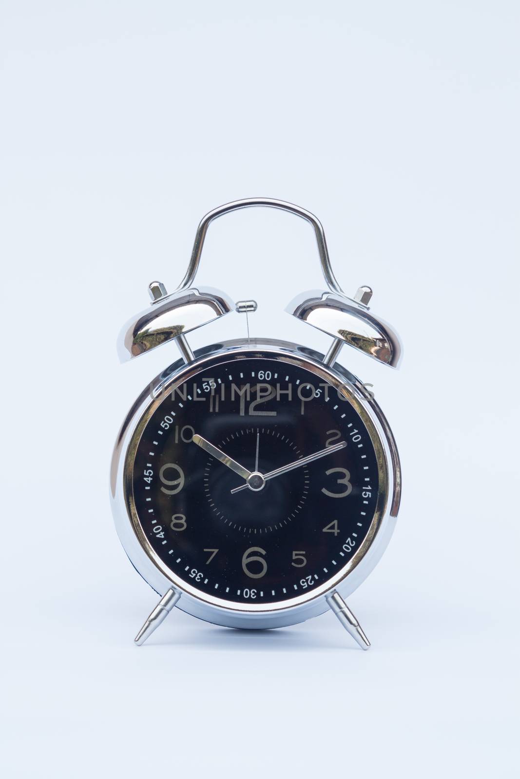 Alarm clock isolated on white background, stock photo