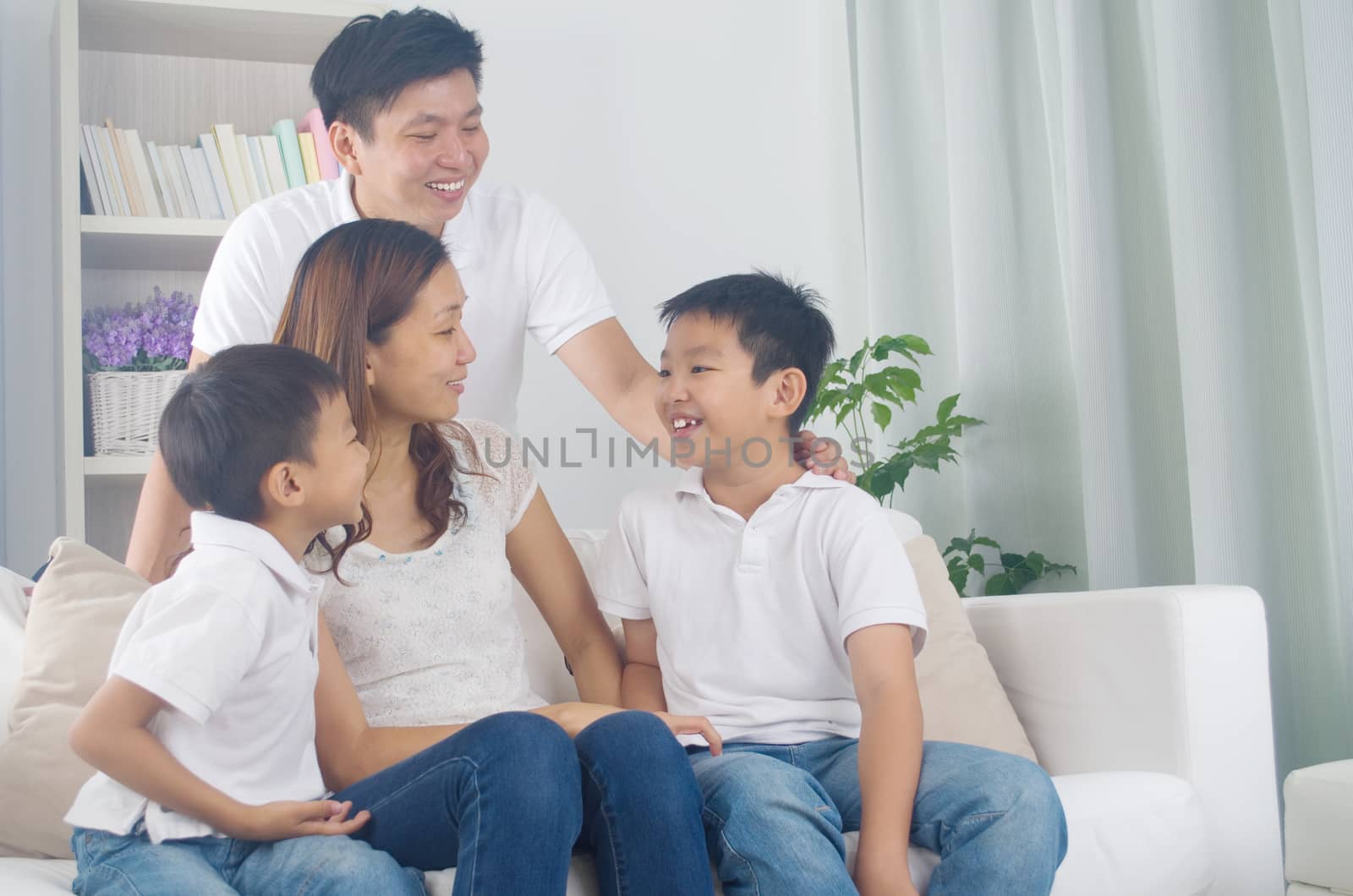 Indoor portrait of asian mixed race family