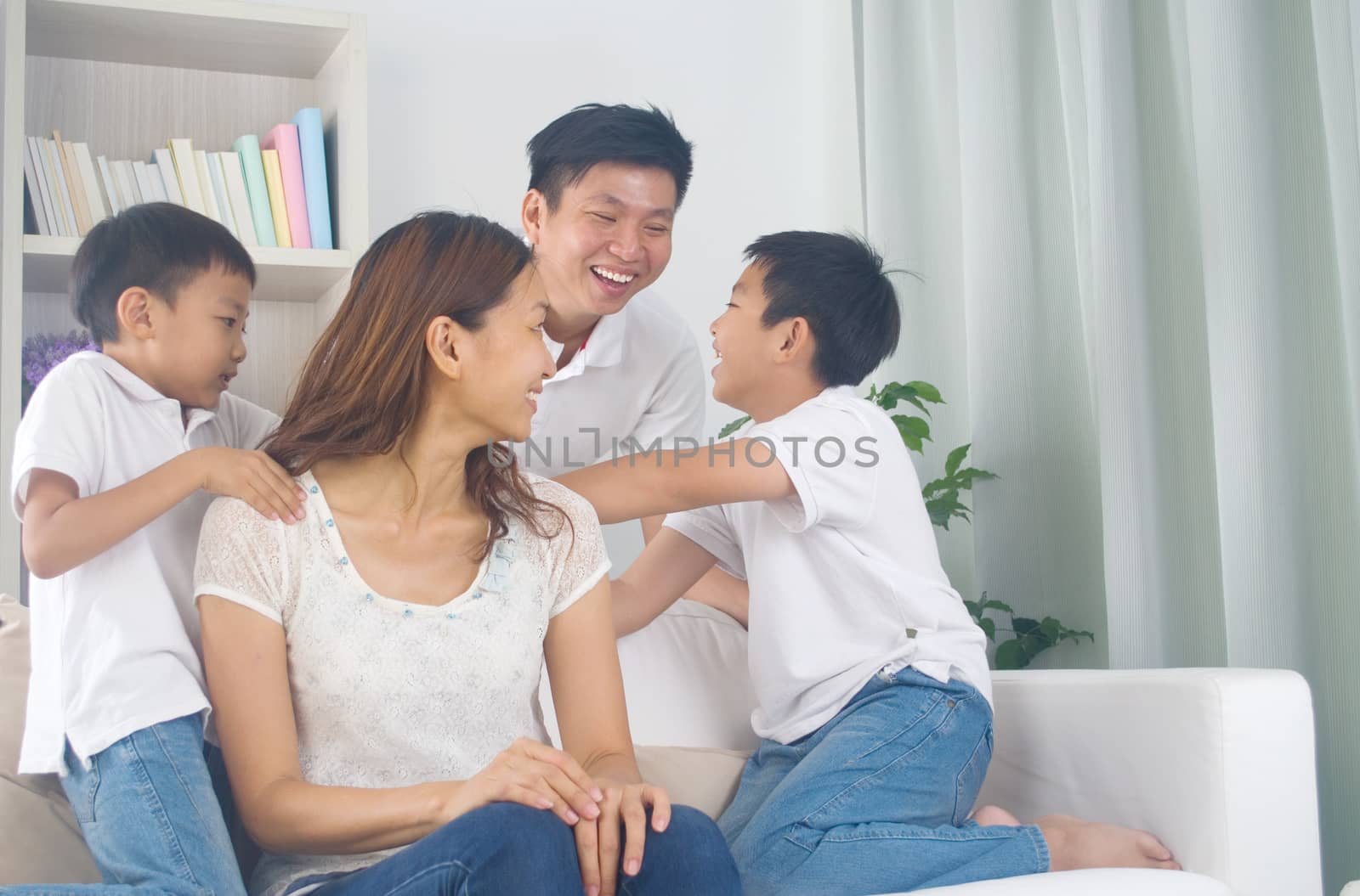 Asian family having fun at home