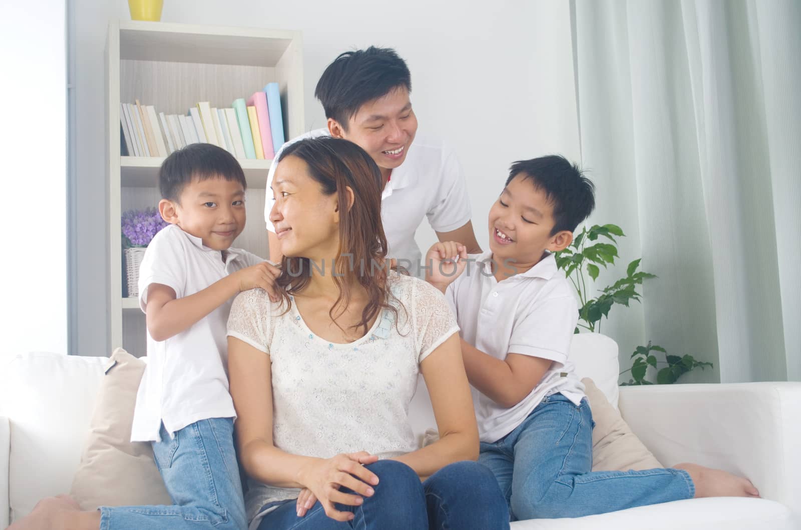 Asian family having fun at home