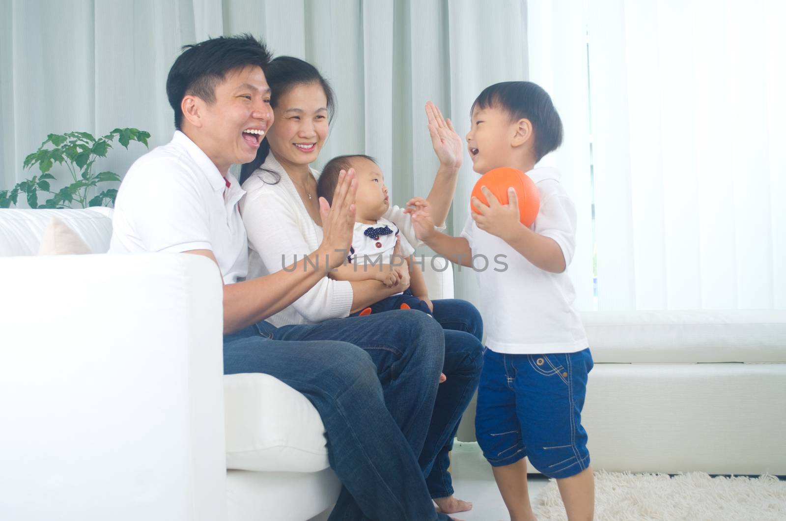 Indoor portrait of asian family