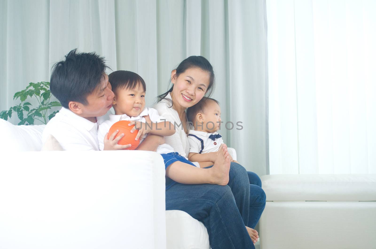 Indoor portrait of asian family