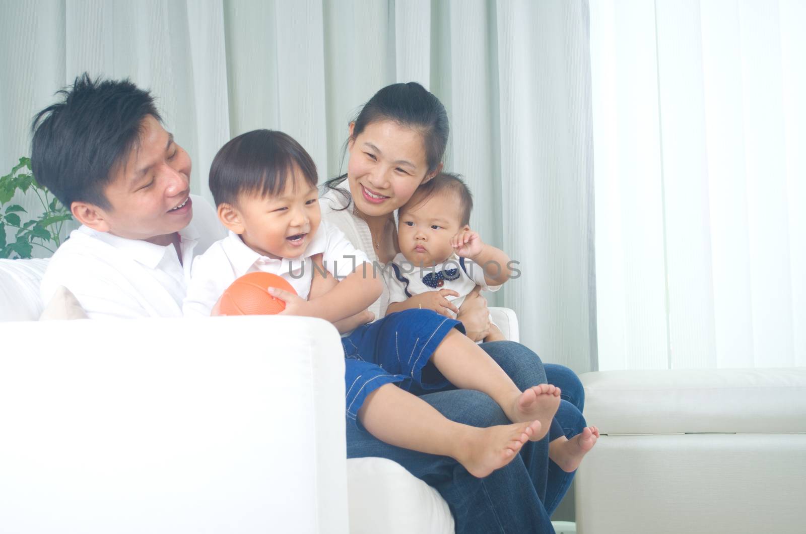 Indoor portrait of asian family