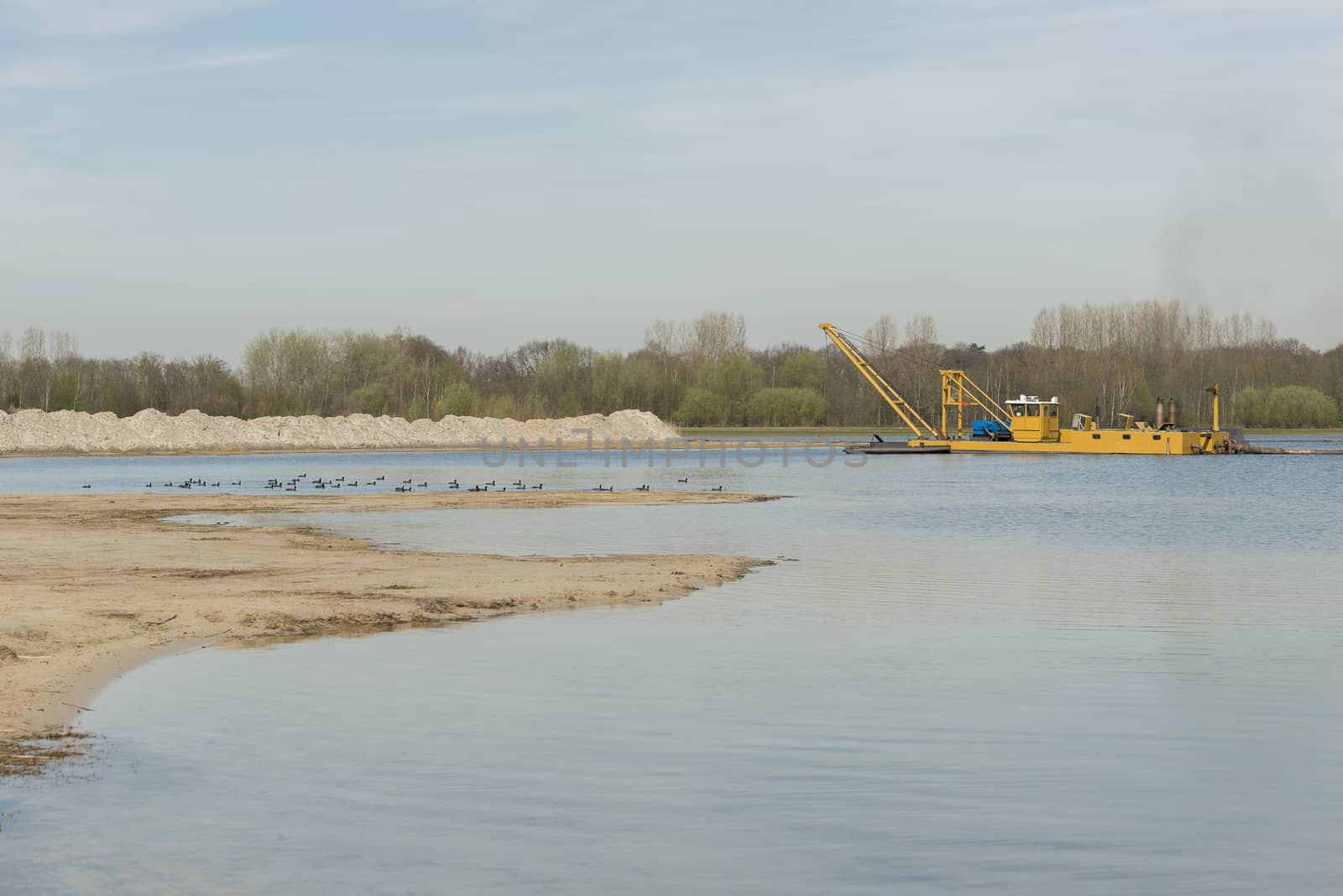 Commercial sand mining on a recreational Lake the Hilgelo near Winterswijk in the Achterhoek in the Netherlands
