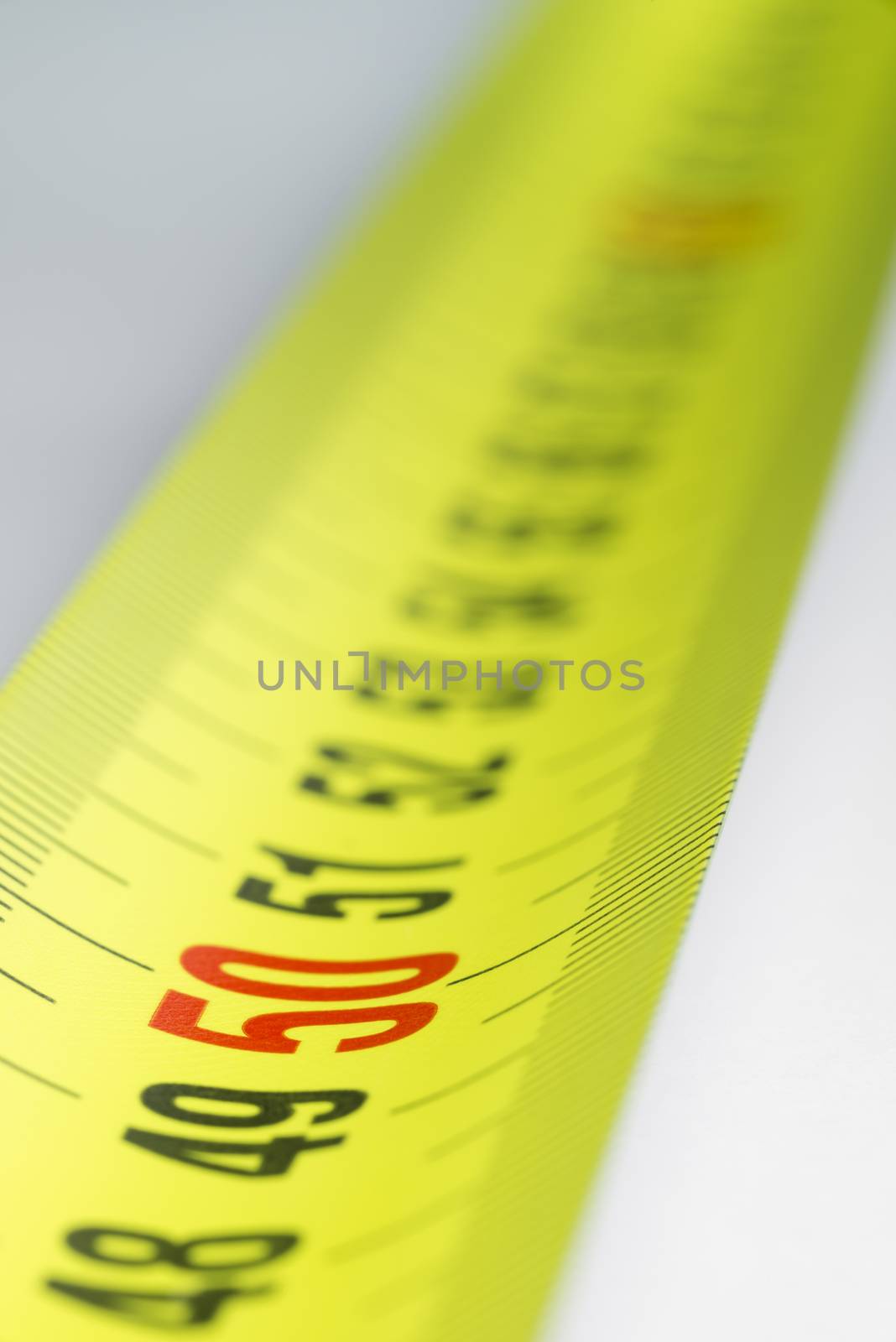 Yellow metal industrial tape measure
 by Tofotografie