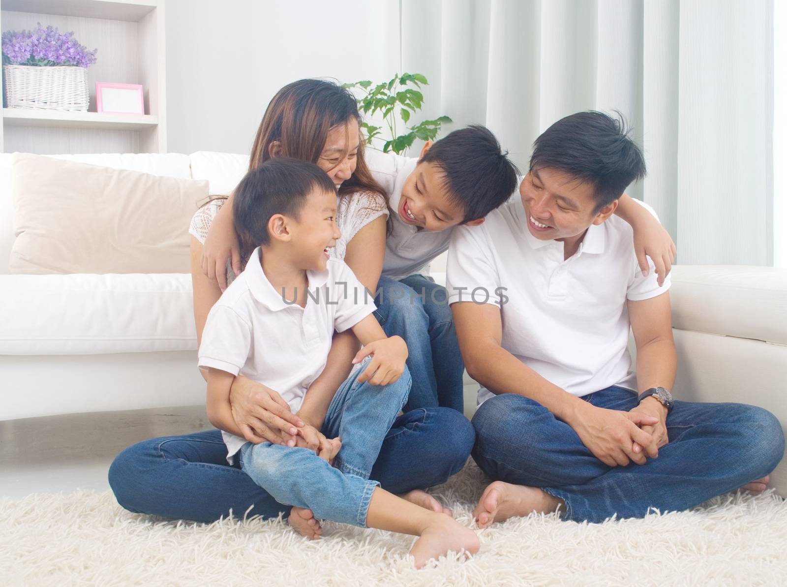 Indoor portrait of asian family