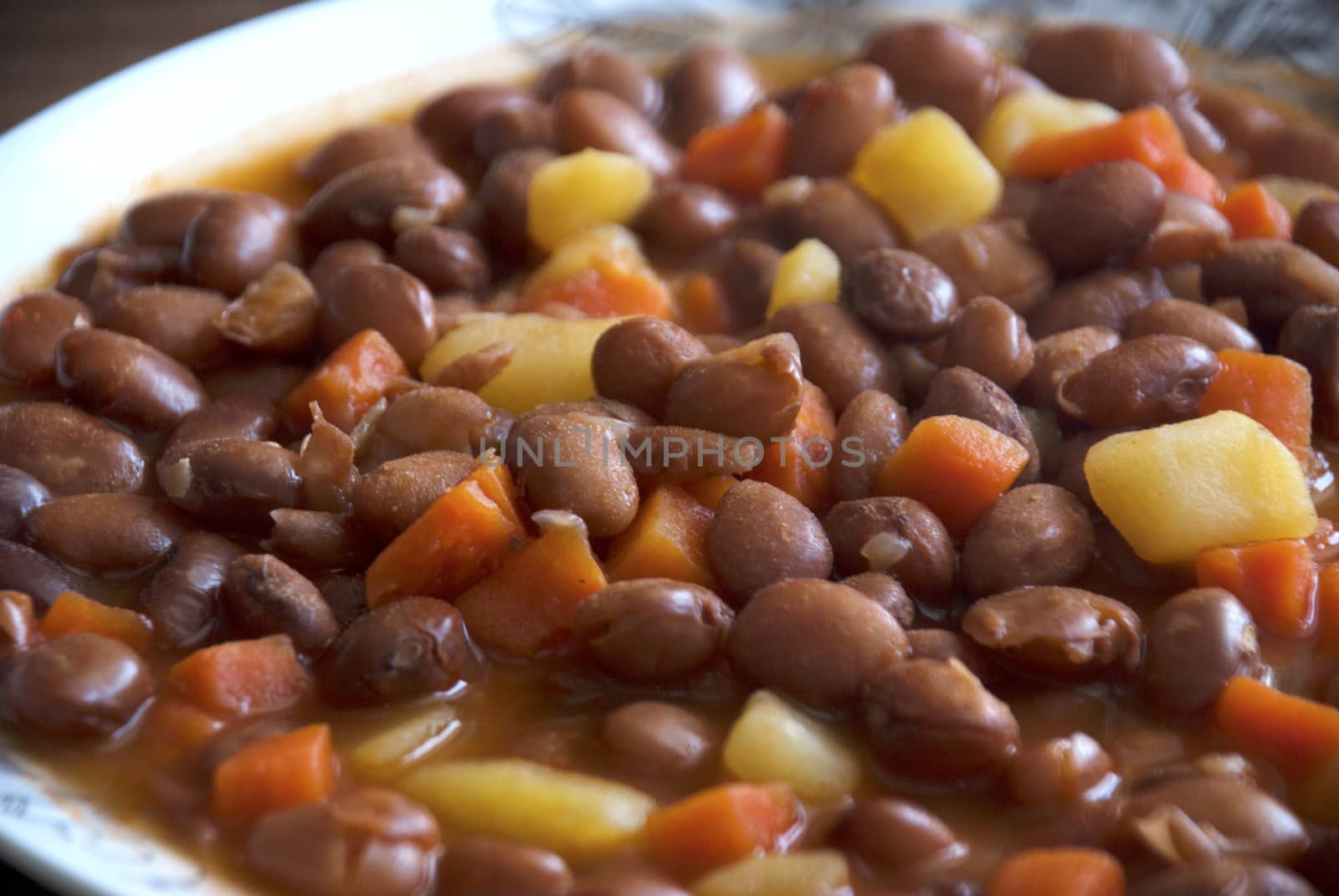 Turkish food: Carrot and potatoes cooked with kidneys meal: Barbunya Pilaki  close- horizontal top view