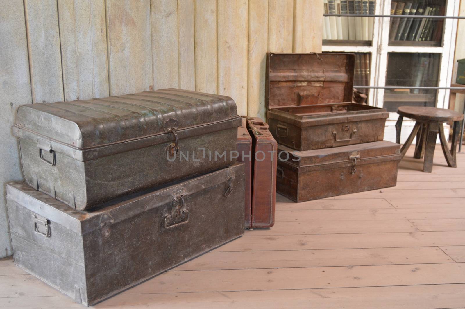 Old scrap boxes on a wooden floor  by Philou1000