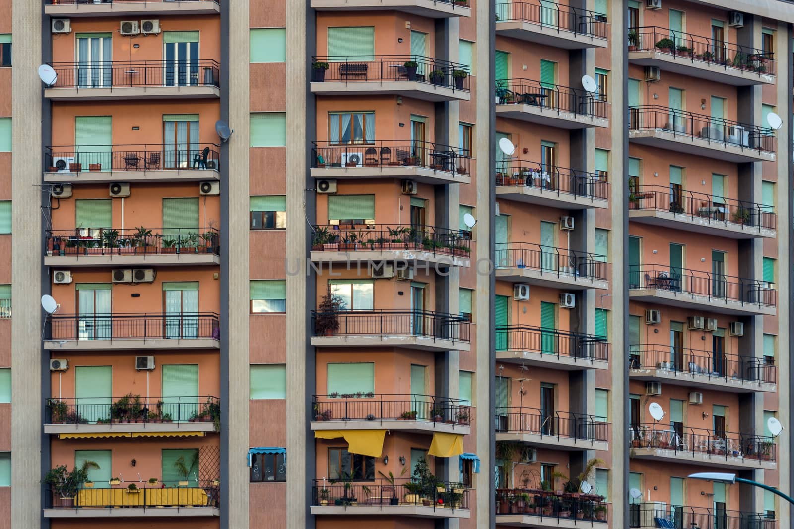 View of a facade of colored apartments with balconies