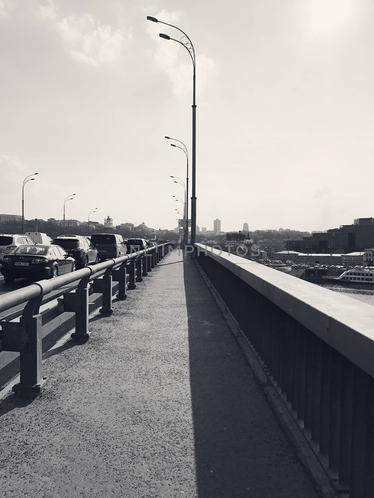 Empty road on a bridge in the big city by Softulka