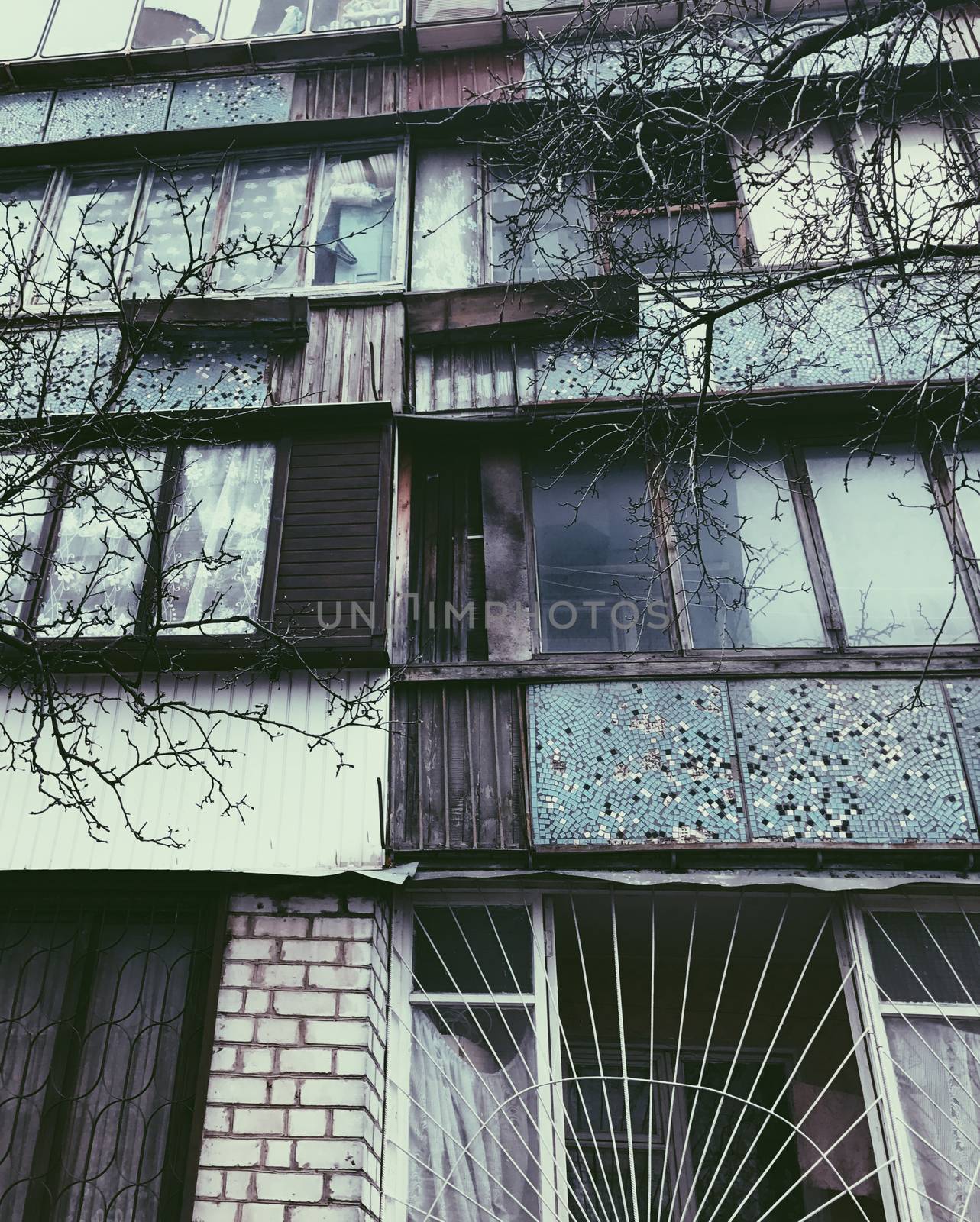 Old building with color bright windows in rural area