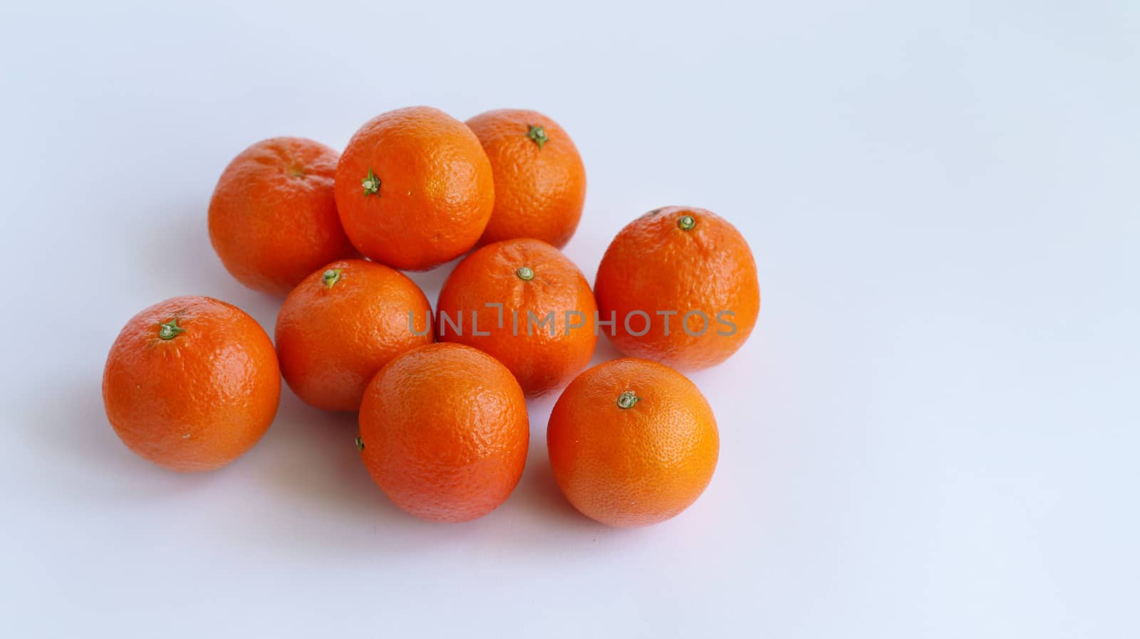 Pile of mandarin on white background. Food fruit