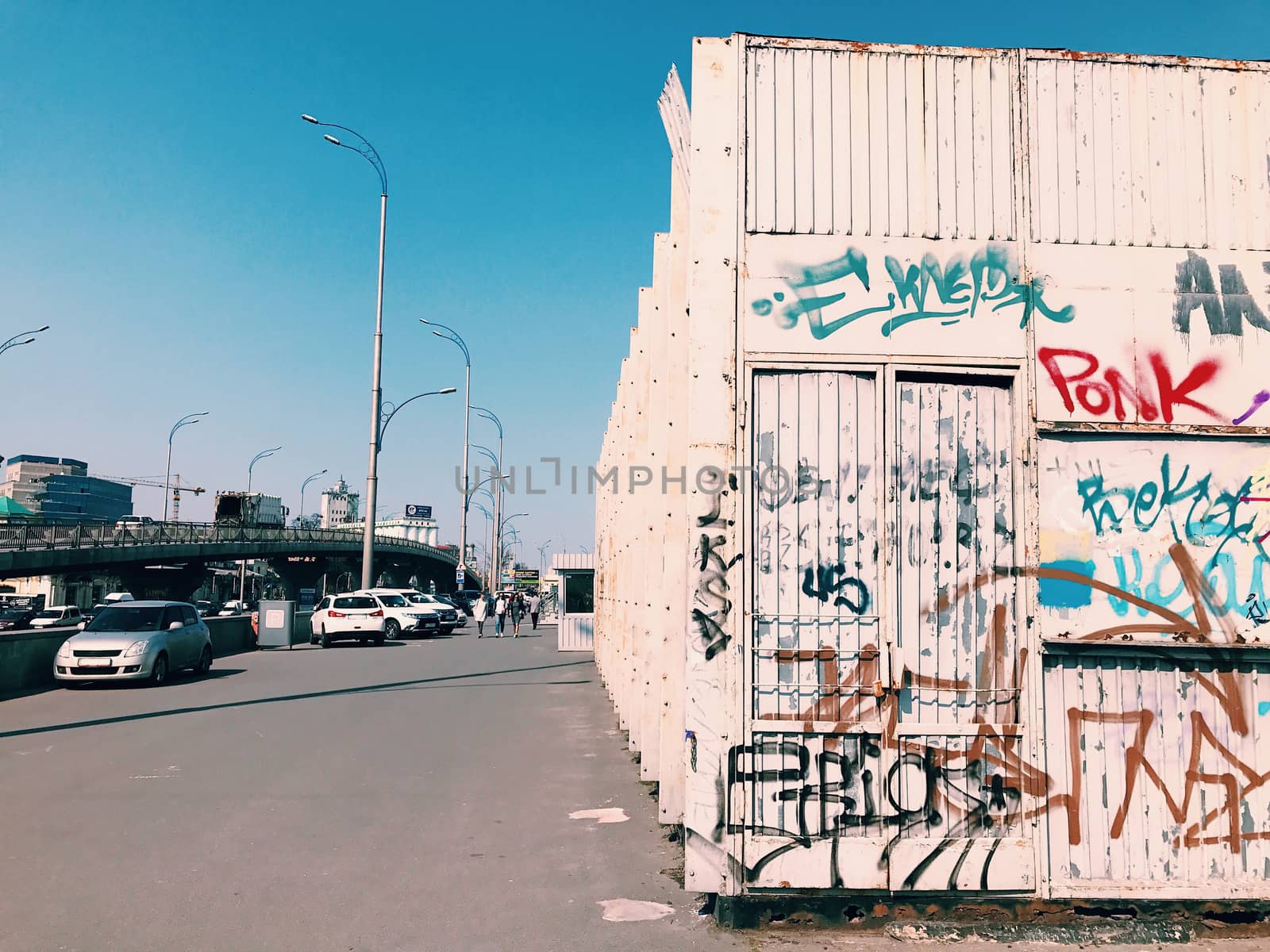 Street art wall, graffiti in a big city on bridge cityscape