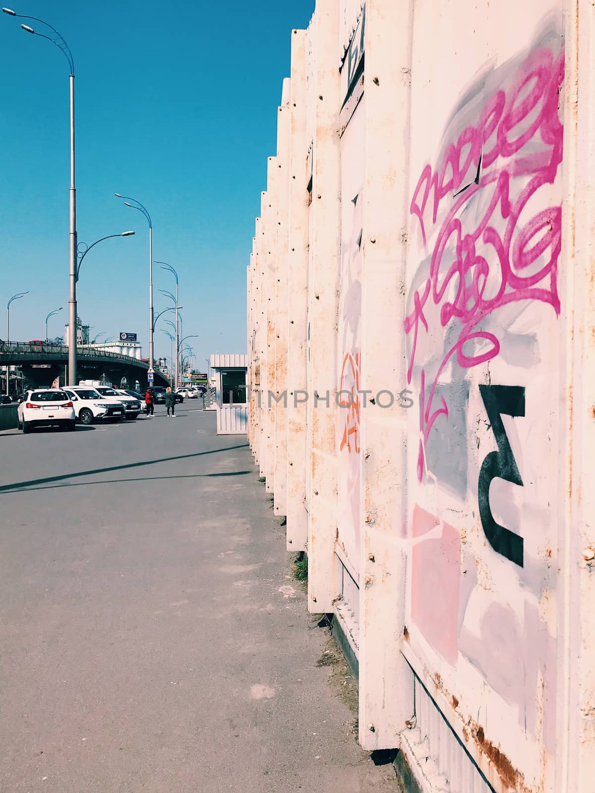 Street art wall, graffiti in a big city on bridge cityscape