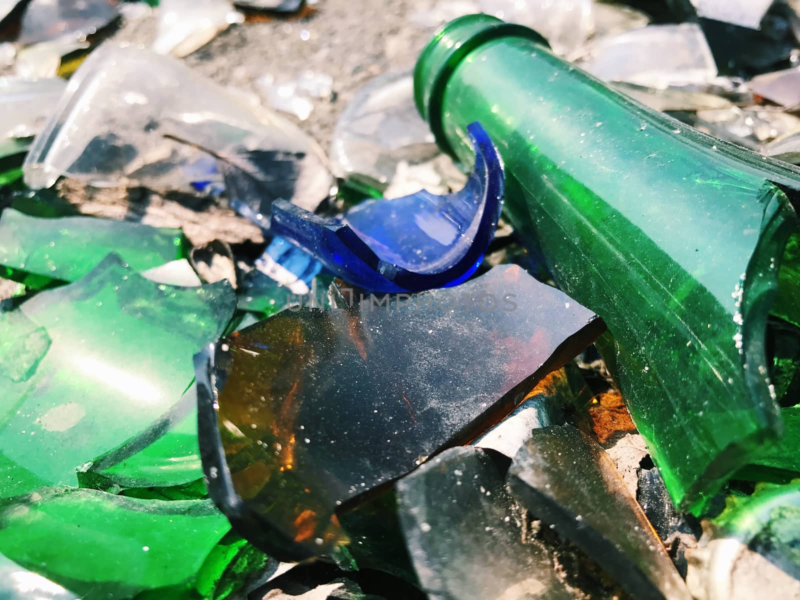 A lot of broken color bottle. Glass garbage background