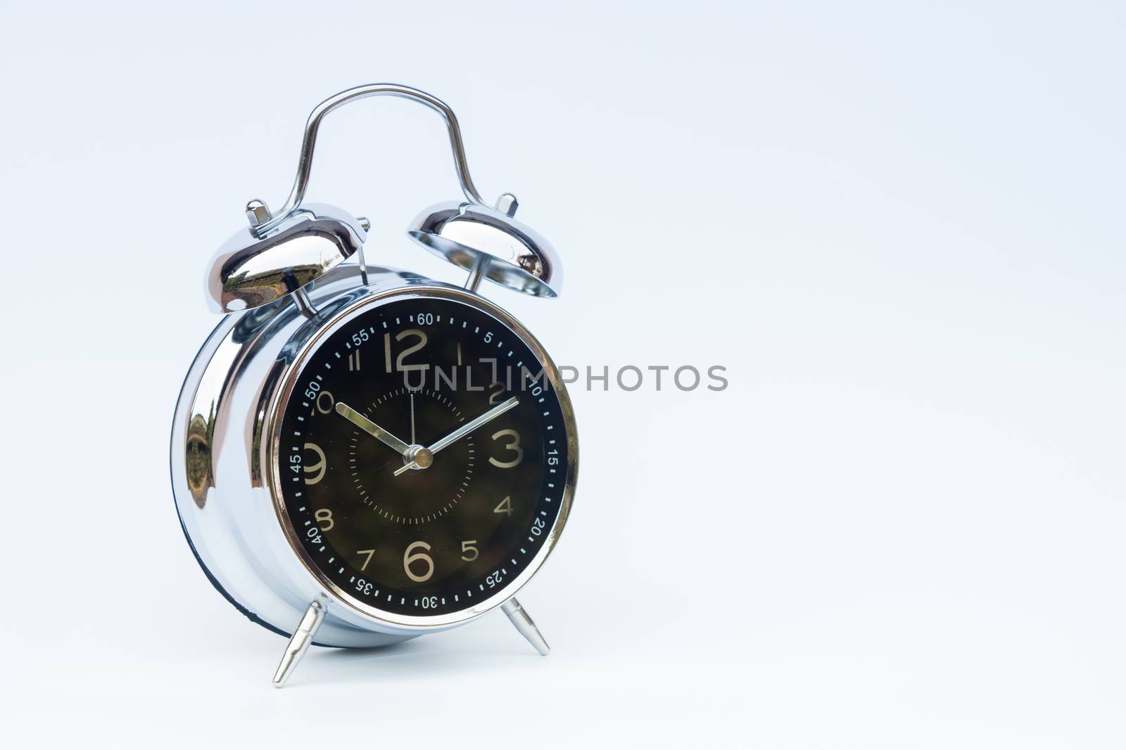 Alarm clock isolated on white background, stock photo