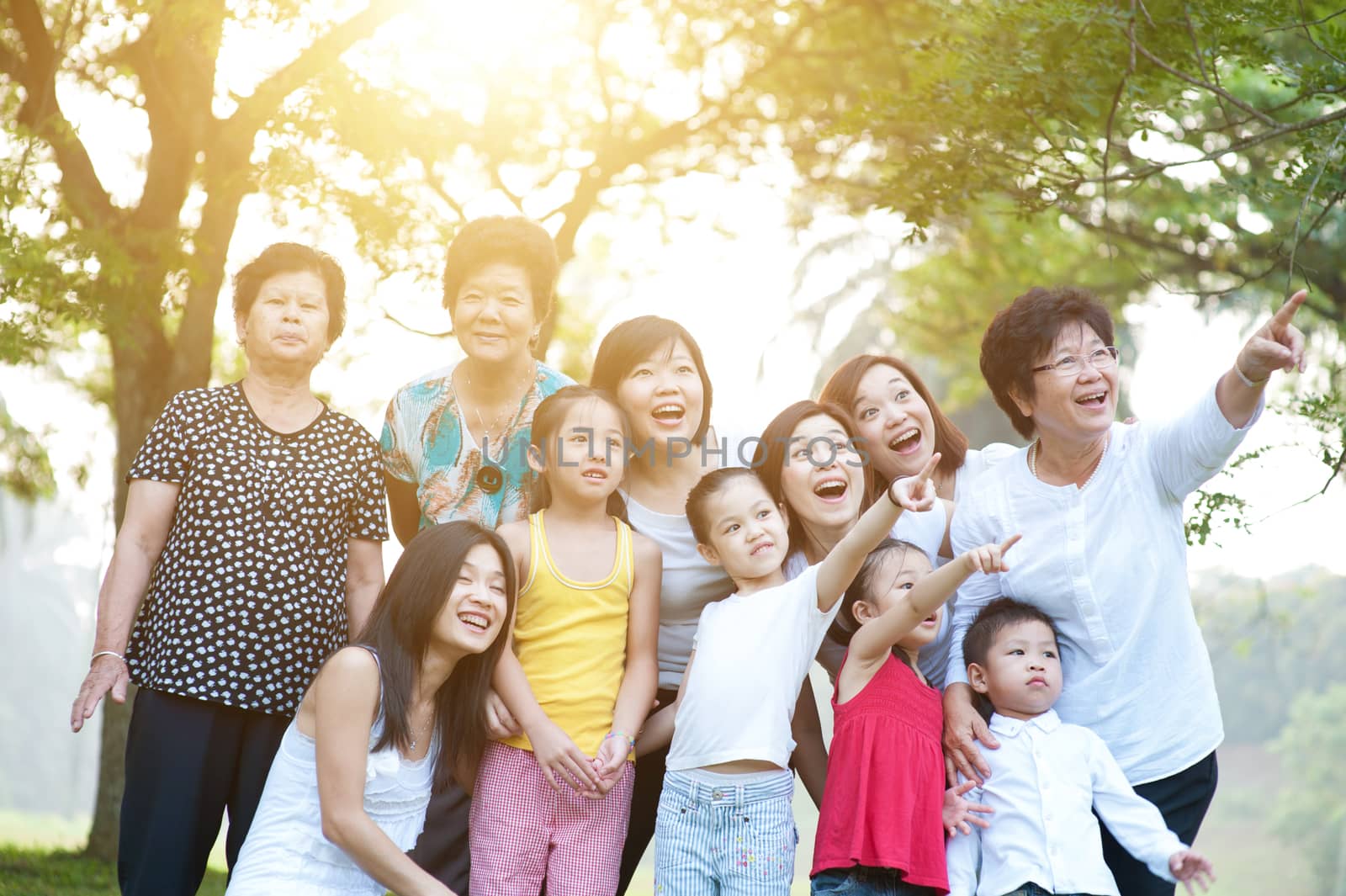 Large group of Asian multi generations family having fun outdoor by szefei