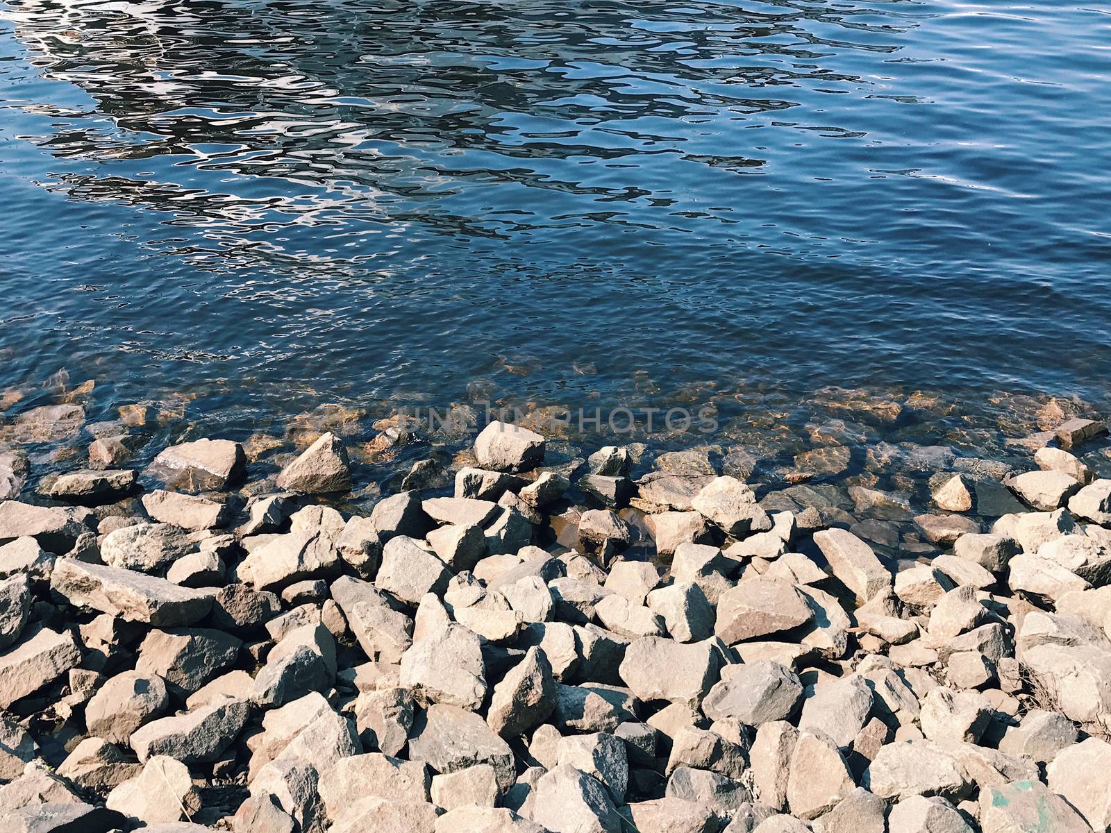 Beach of river with cool stones in the spring