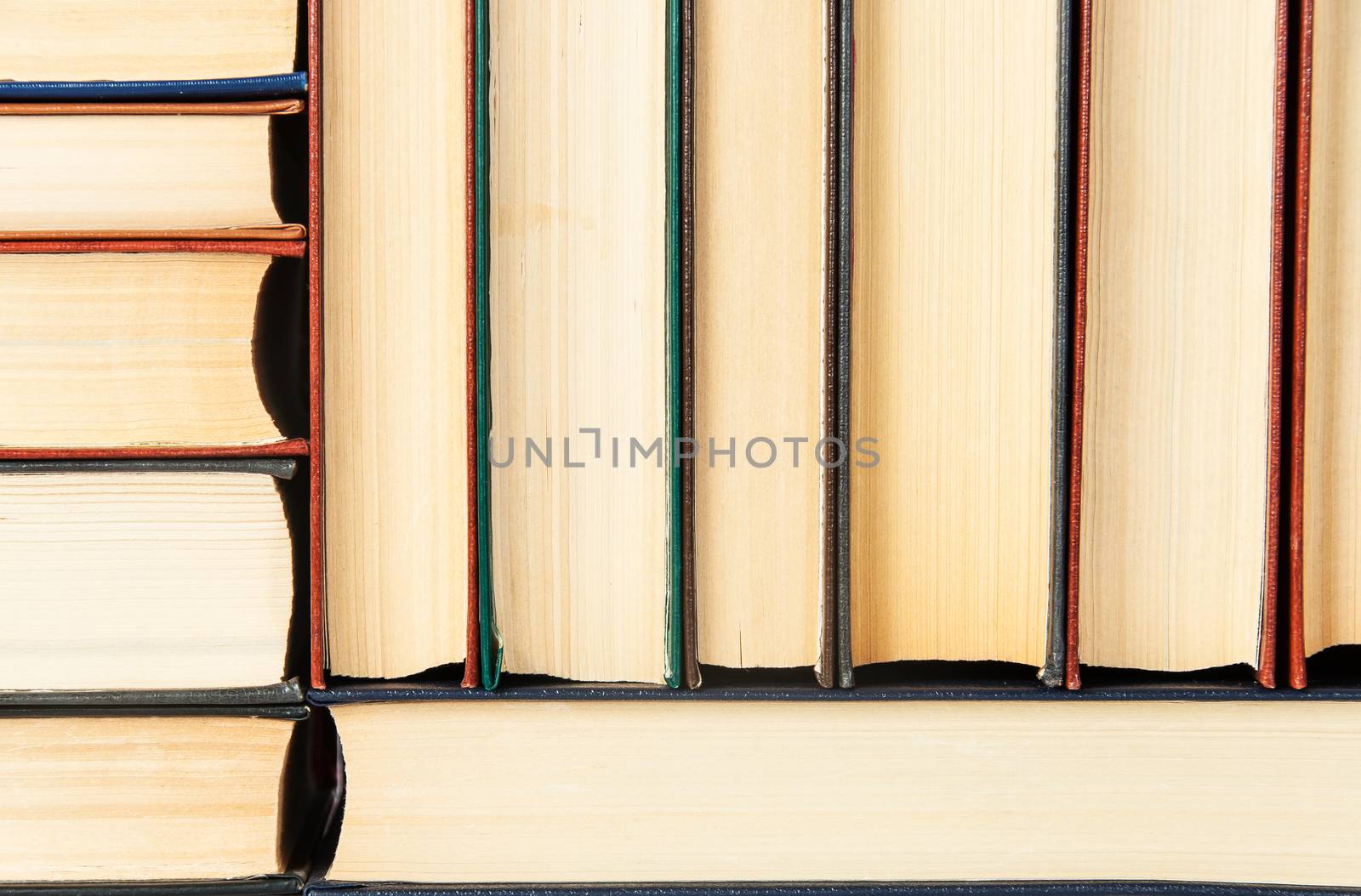 Closeup abstract background of stacked on each other old books